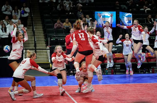 Benilde-St. Margaret's players celebrate their 3 games to none win over Kasson-Mantorville during Class 3A volleyball semifinals Friday, Nov. 11, 2022 at Xcel Energy Center in St. Paul, Minn.