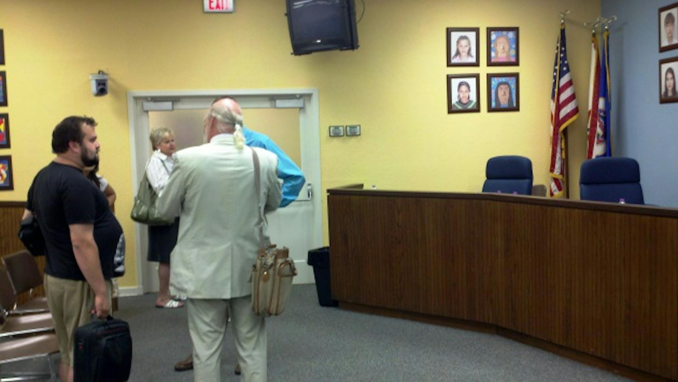 Activist David DeGrio, teacher union President Lynn Nordgren and board member Richard Mammen conversed after the last board meeting at 807 Broadway