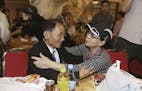 South Korean Kim Hye-ja, 75, right, meets with her North Korean younger brother Kim Eun Ha, 75, during a separated family reunion meeting at the Diamo