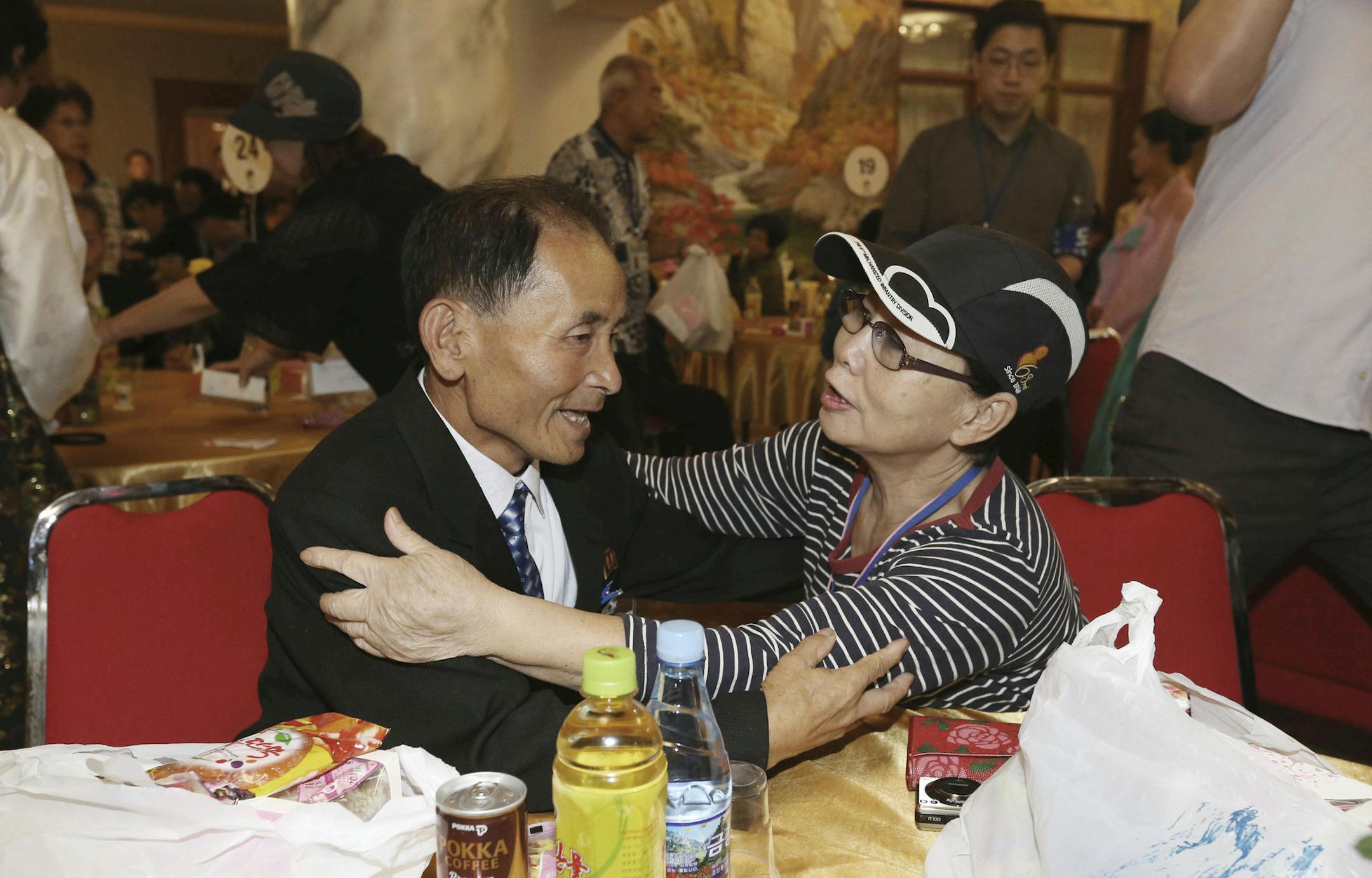 South Korean Kim Hye-ja, 75, right, meets with her North Korean younger brother Kim Eun Ha, 75, during a separated family reunion meeting at the Diamond Mountain resort in North Korea, Tuesday, Aug. 21, 2018. Dozens of elderly South Koreans crossed the heavily fortified border into North Korea on Monday for heart-wrenching meetings with relatives most haven't seen since they were separated by the turmoil of the Korean War. (Korea Pool Photo via AP)