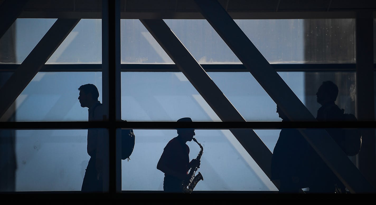 Richard Fairbanks, of Minneapolis, played the saxophone for passersby in the skyway over Fourth Avenue connected to the Hennepin County Government Center Friday afternoon. Fairbanks says he plays in that specific skyway every Friday during the colder months of the year and spends the rest of the time playing on the Stone Arch Bridge. "I like this spot because I like to play for couples who get married by a justice of the peace (at the government center)," said Fairbanks. "It's very touching to m