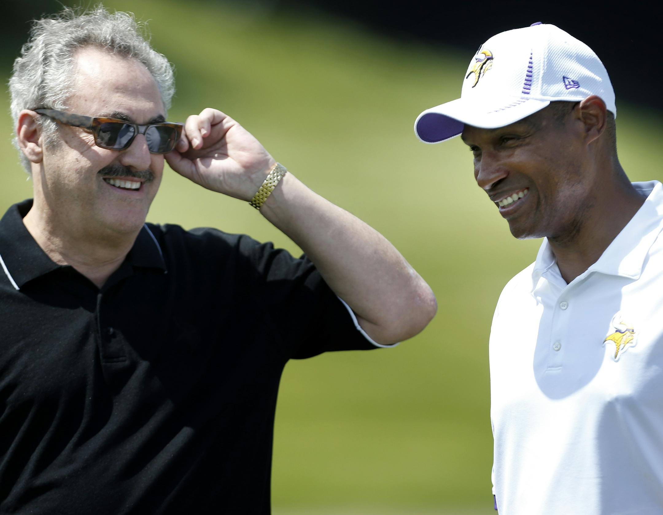 Minnesota Vikings owner Zygi Wilf and head coach Leslie Frazier spoke during practice on Wednesday. ] CARLOS GONZALEZ cgonzalez@startribune.com June 19, 2013, Eden Prairie, Minn., Winter Park, Minnesota Vikings minicamp ORG XMIT: MIN1306191755248528