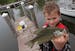 Noah Goodrich, age-9 from Minnetonka, held up a fish he caught while fishing off the docks at Lord Fletchers, in the Minnesota Bound's Crappie Contest