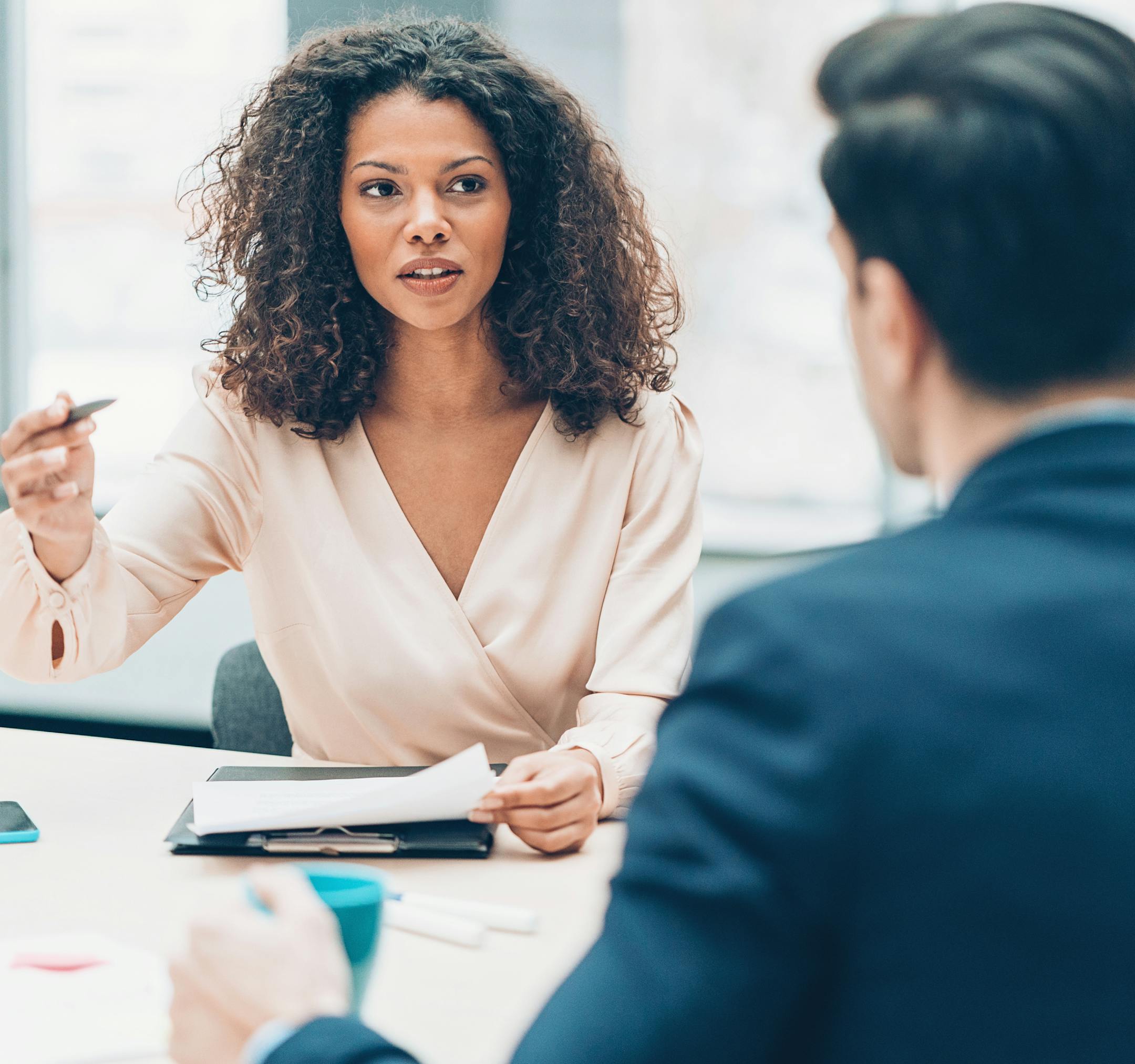 Two businesspersons talking in the office
