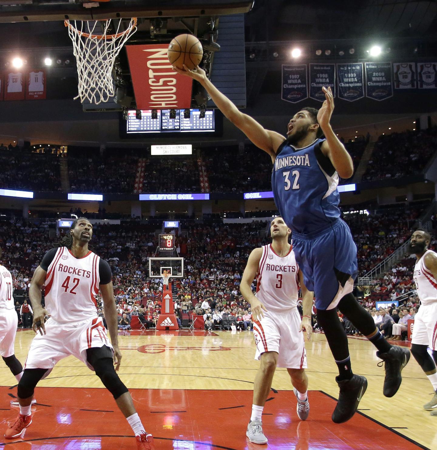 Minnesota Timberwolves' Karl-Anthony Towns (32) goes up for a shot against the Houston Rockets during the first half of an NBA basketball game, Wednesday, April 12, 2017, in Houston. (AP Photo/David J. Phillip)