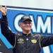 Morgan Shepherd waves to cheering fans as he is introduced for the NASCAR Sprint Cup series auto race at New Hampshire Motor Speedway, Sunday, July 14