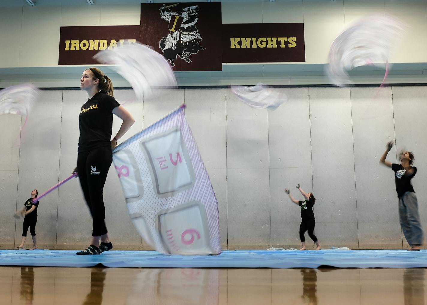 Dakota McKnight, a sophomore on the Irondale High School color guard, looked on as teammates practiced their tosses during practice Tuesday night. ] AARON LAVINSKY &#xef; aaron.lavinsky@startribune.com All zone feature on popularity and growing competitive of prep drum lines and color guards, focusing on the metro area. We photograph the Irondale High School color guard as they practiced on Tuesday, March 21, 2017 at Irondale High School in New Brighton, Minn.