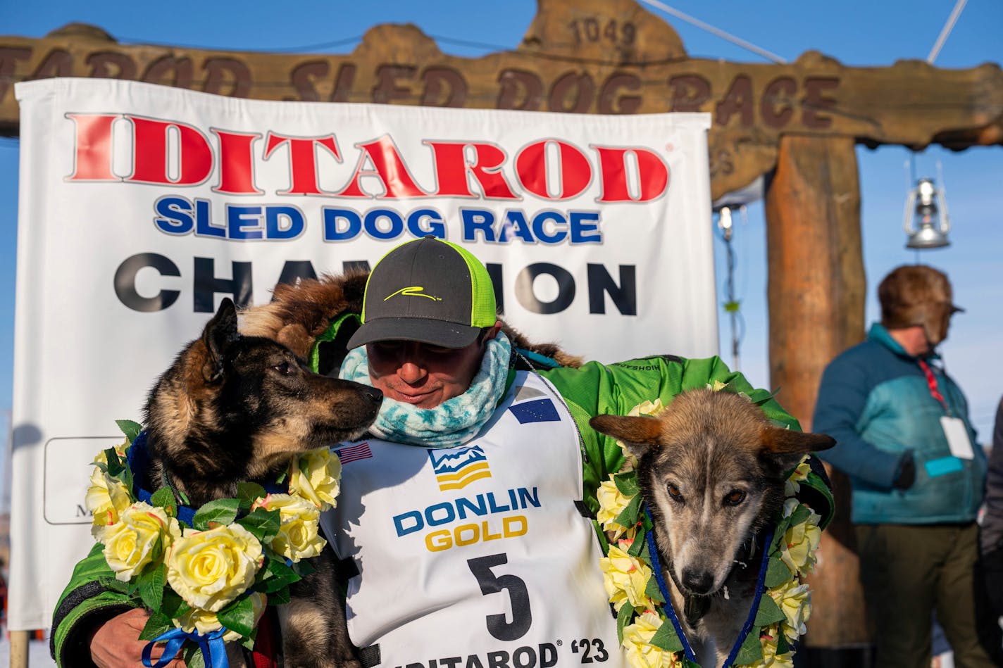 Ryan Redington posed with his lead dogs Sven, left, and Ghost, after he won the 2023 Iditarod Trail Sled Dog Race, Tuesday, March 14, 2023 in Nome, Alaska. Redington, 40, is the grandson of Joe Redington Sr., who helped co-found the arduous race across Alaska that was first held in 1973 and is known as the "Father of the Iditarod." (Loren Holmes/Anchorage Daily News via AP)