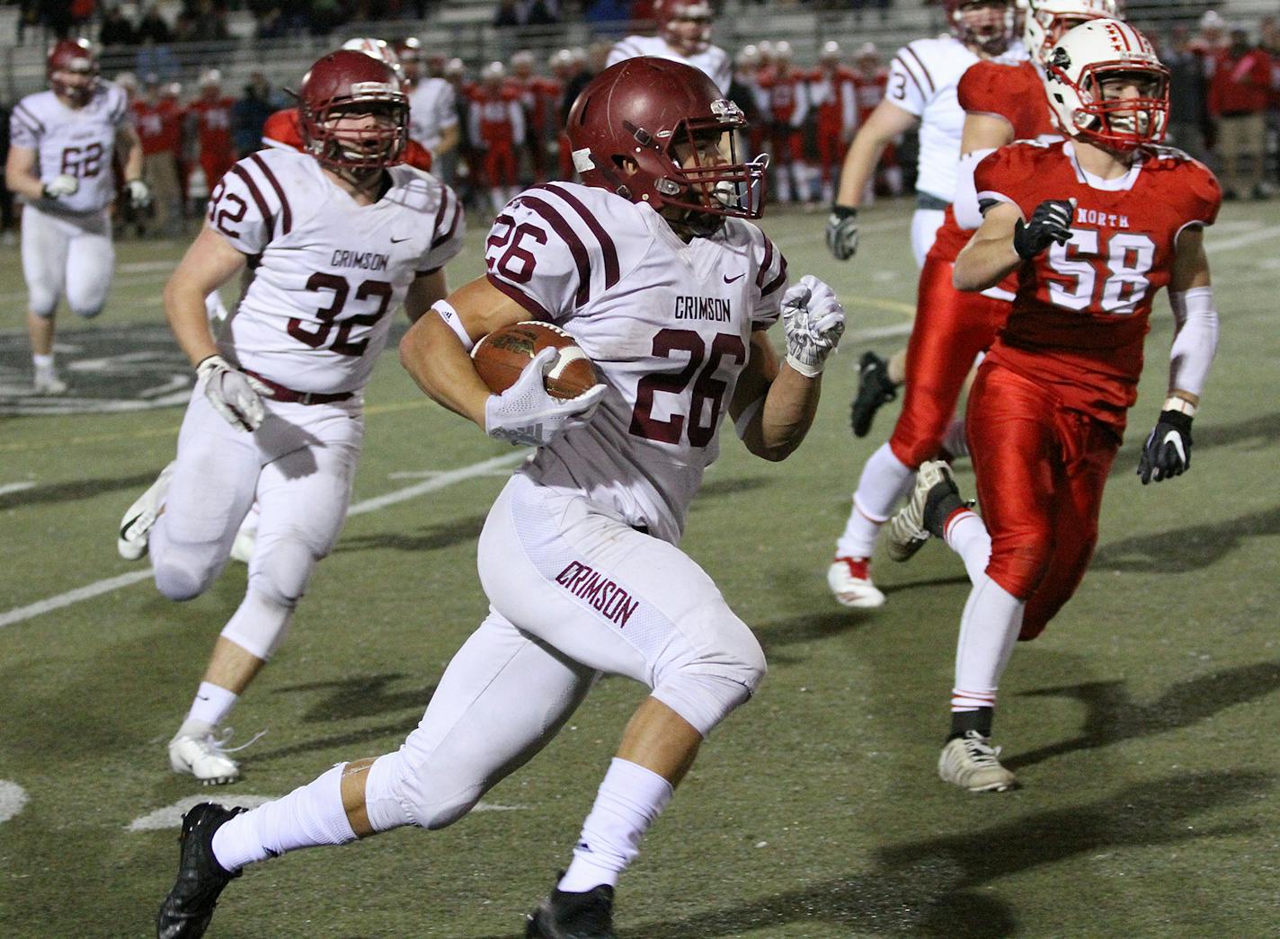 Maple Grove's Evan Hull (26) ran for yardage in a Class 6A second-round game against Lakeville North on Nov. 2. Photo by Drew Herron, SportsEngine