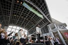 Roderick Cox conducts the Minnesota Orchestra during their Symphony for the Cities performance at the Lake Harriet Bandshell in Minneapolis on Monday,