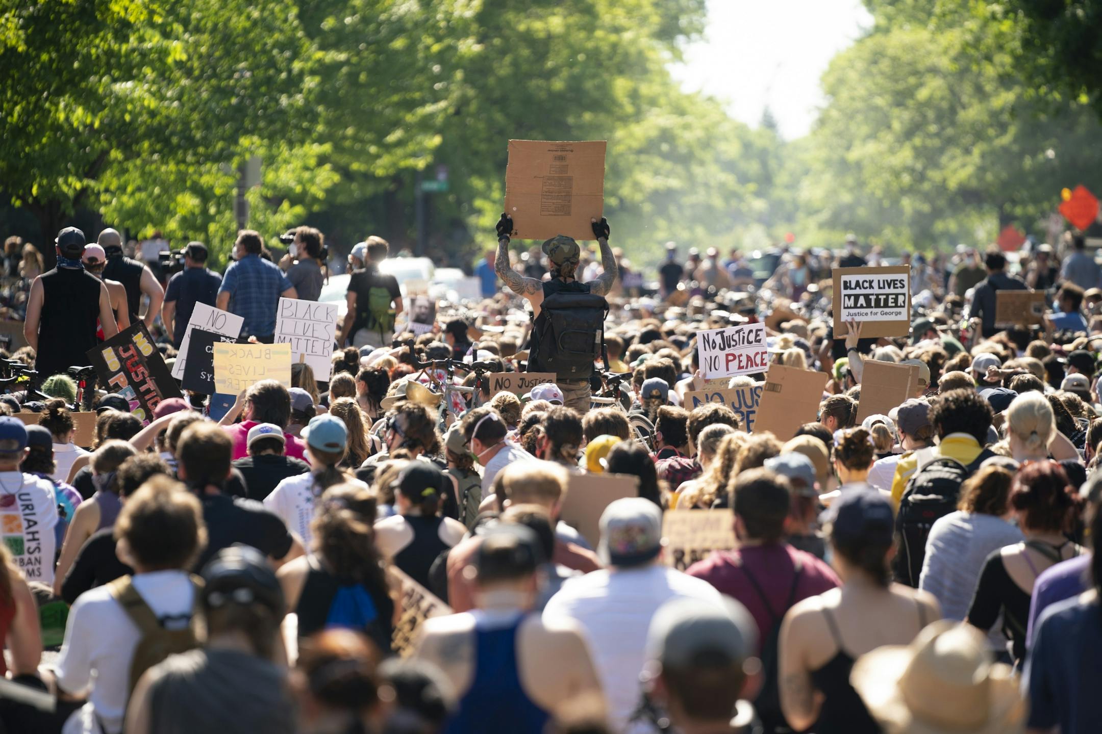 The crowd filled the street for the entire block in front of the Governor's residence.
