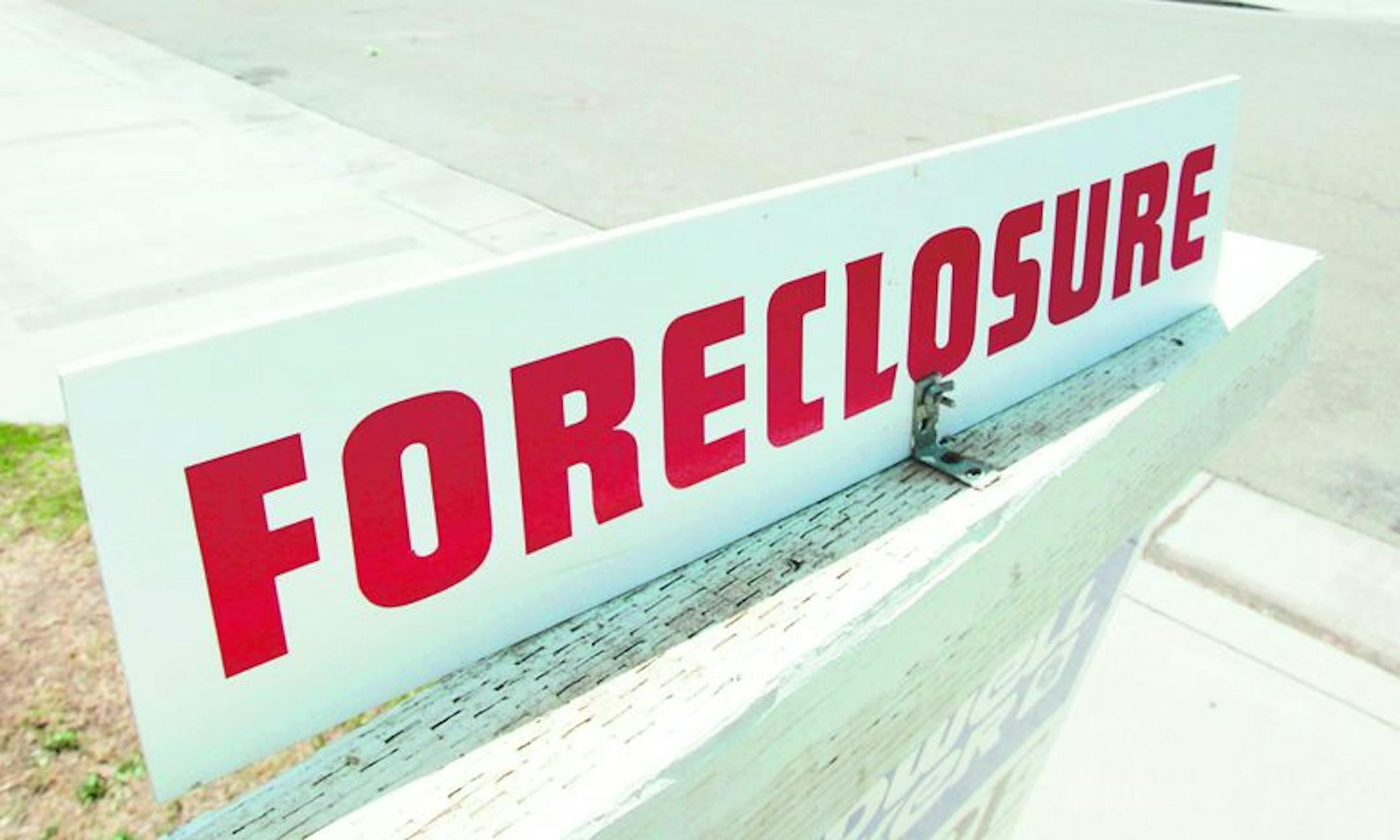 In this May 7, 2008 file photo, a foreclosure sign is seen on the lawn of a home for sale in Stockton, Calif. Among metro areas, Stockton, Calif., was first, with 9.5 percent of all housing units receiving a foreclosure filing in 2008.