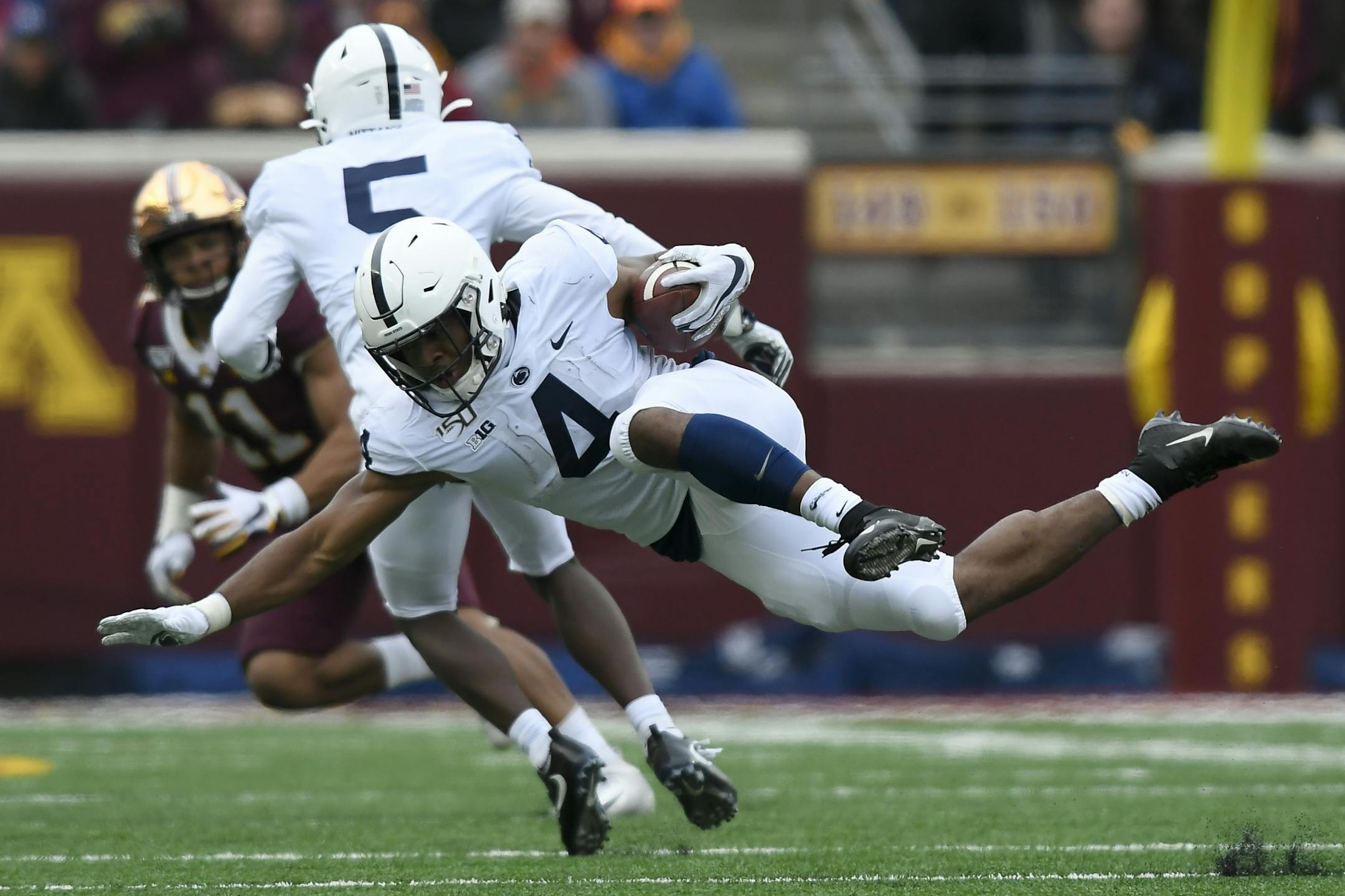 Minnesota Gophers defensive back Coney Durr (16) tripped up Penn State Nittany Lions running back Journey Brown (4) in the second half.