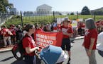 Moms Demanding Action line up during a rally at the State Capitol in Richmond, Va., Tuesday, July 9, 2019. Governor Northam called a special session o