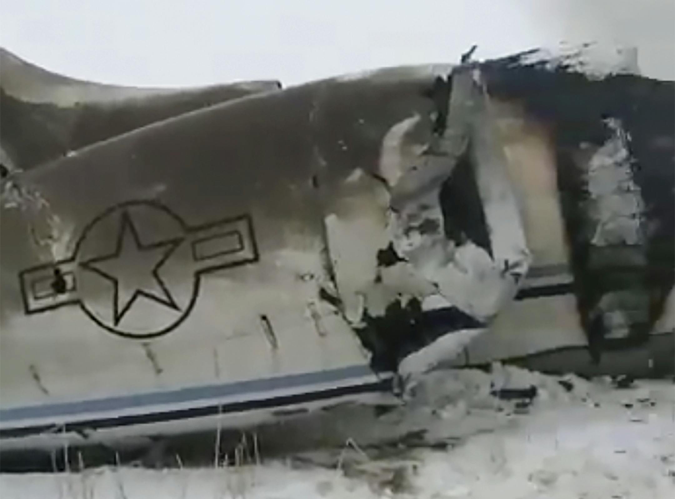 This photo provided by Tariq Ghazniwal shows an aircraft that crashed in eastern Afghanistan on Monday, Jan. 27, 2020. The U.S. military says it is investigating reports of an airplane crash in Taliban-controlled territory in Afghanistan. U.S. Army Maj. Beth Riordan, a spokeswoman for U.S. Central Command, said that it remained unclear whose aircraft was involved in the crash. (Tariq Ghazniwal via AP)