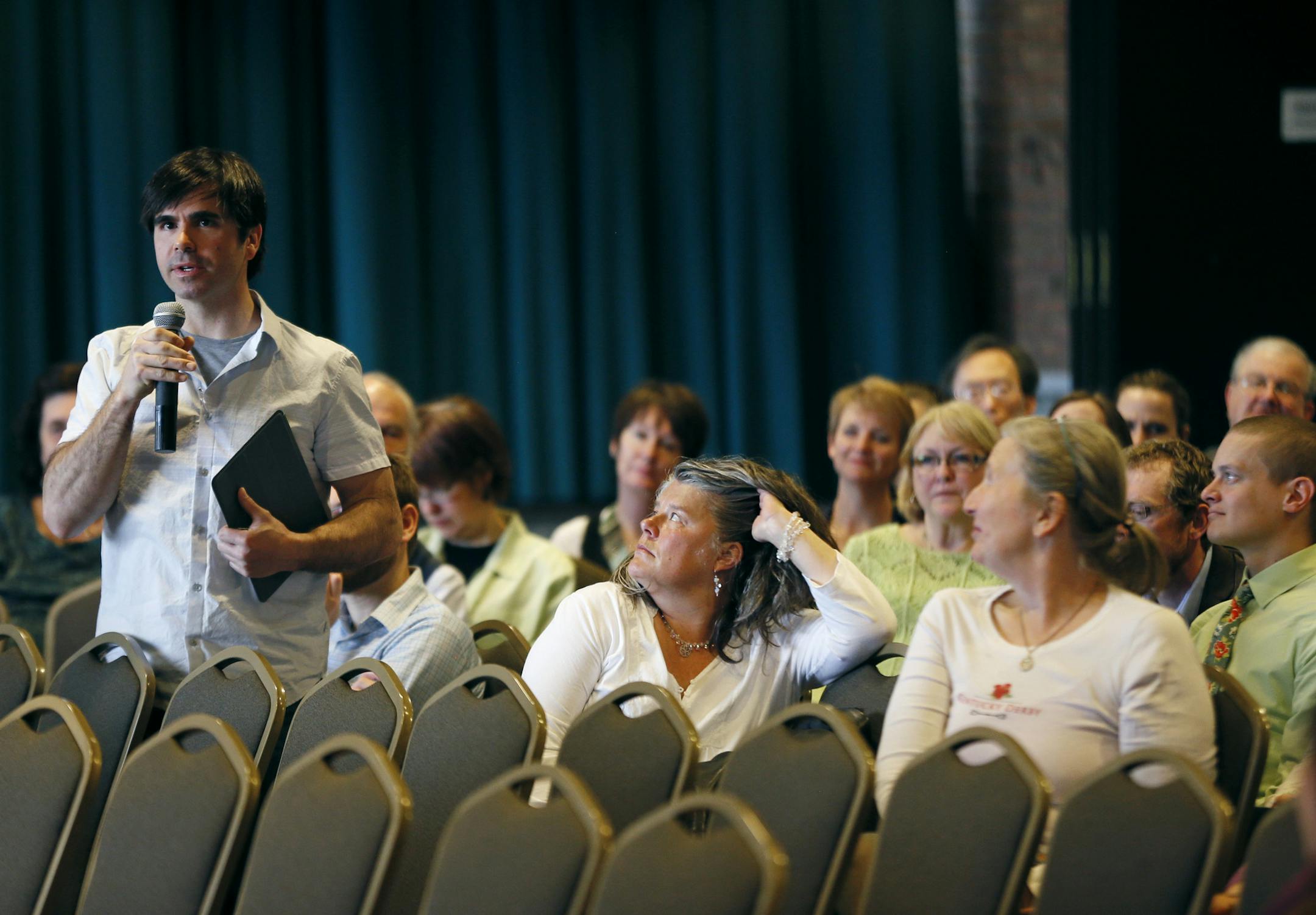 Frank Maragi a staff member in the biology department at UMD asked a question during a Town Hall meeting . University of Minnesota Duluth chancellor, Lendley Black hosted a "Town Hall" meeting for faculty, staff and students to give and update on the progress toward digging the Duluth campus out of of a multi-million dollar budget hole Thursday May 15, 2014 in Duluth , MN. ] Jerry Holt Jerry.holt@startribune.com