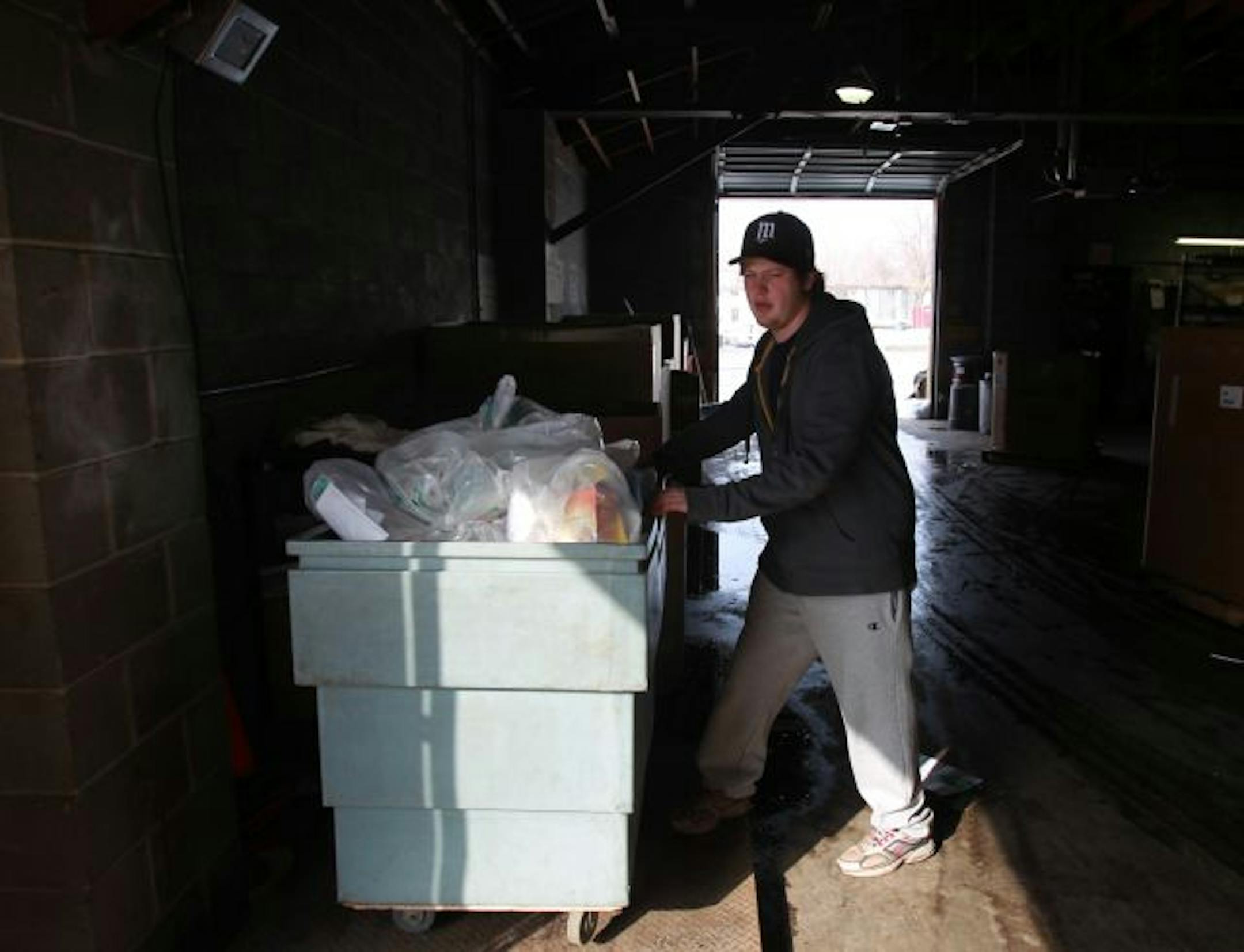 Evan Kapaun a senior at the University of Minnesota weighed recycle items pulled from dorms during a two week competition to see which dorm recycled the most.