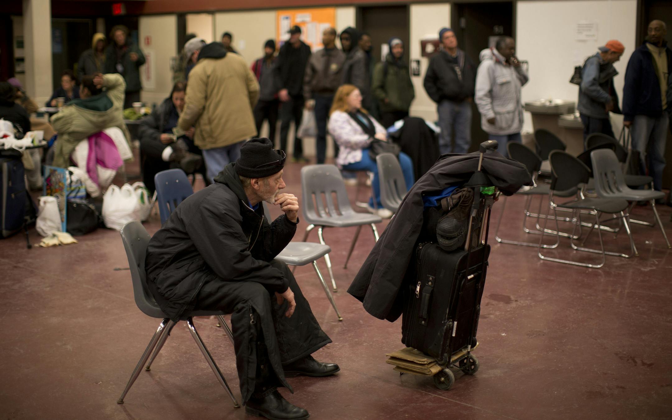 Rock Krueger waited with others for the evening meal to be served Thursday at the Dorothy Day Center in downtown St. Paul.