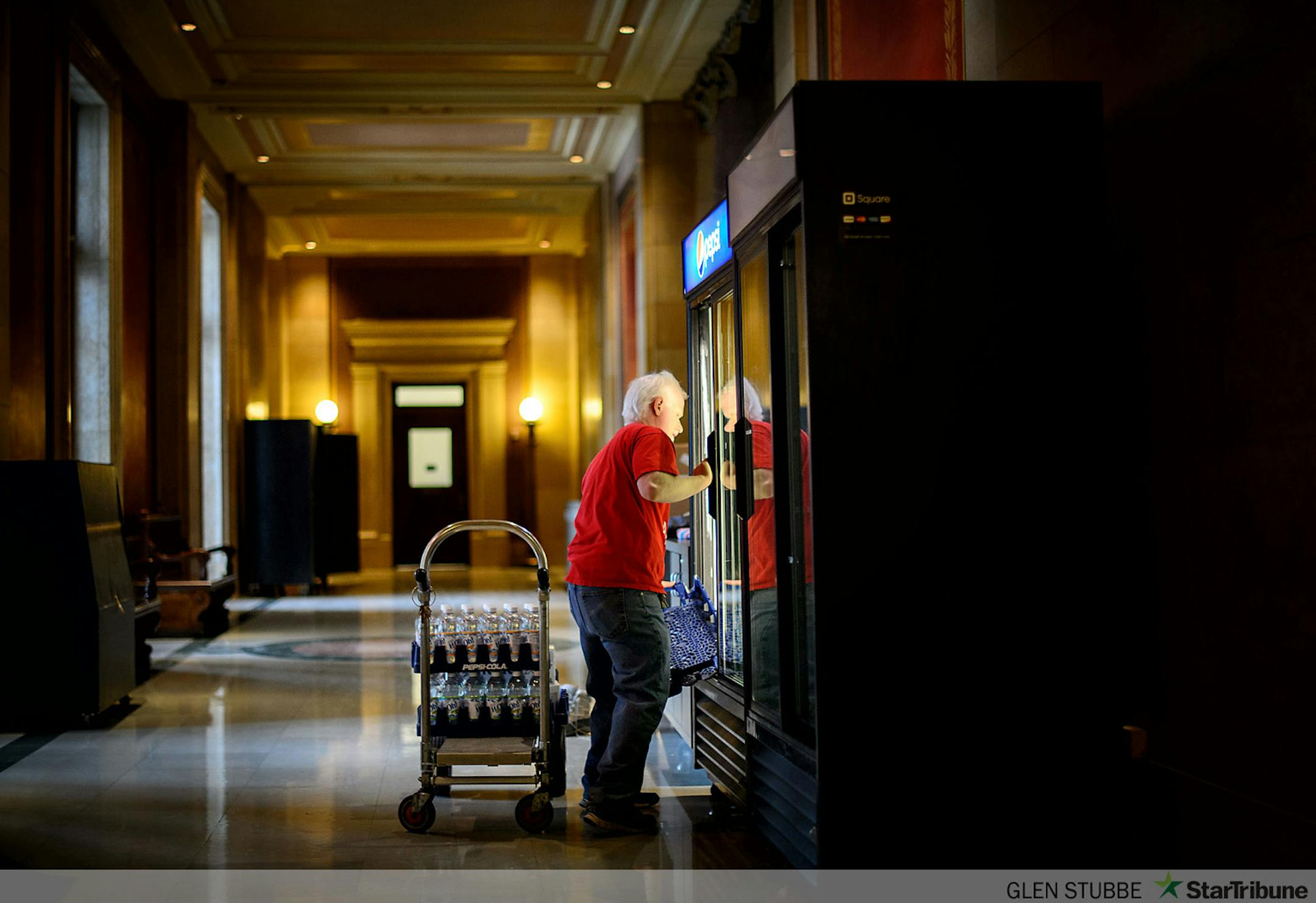 Starting his 8th legislative session, legally blind Alex Lee stocked soda into second floor coolers  Monday, February 24, 2014, hours before the State Legislature reconvened Tuesday.  State Services for the Blind runs concessions in the Capitol.  ]   GLEN STUBBE * gstubbe@startribune.com