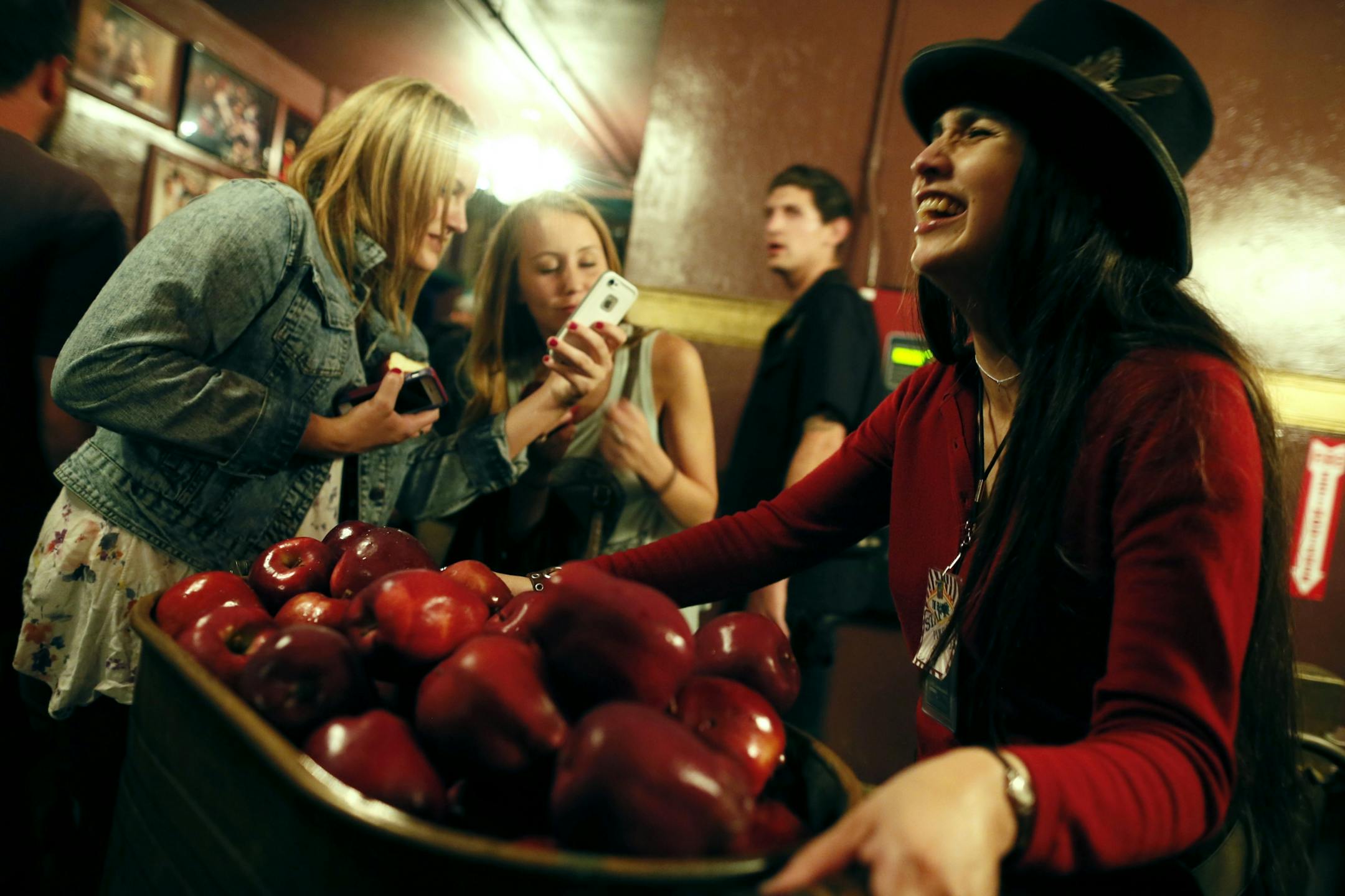 Diana Sears passed out apples after a recent show at the Fillmore. Sears an employee at the Fillmore said that Bill Graham started giving apples to fans in 1965 after shows. Photos of historic rock sites in San Francisco , CA.