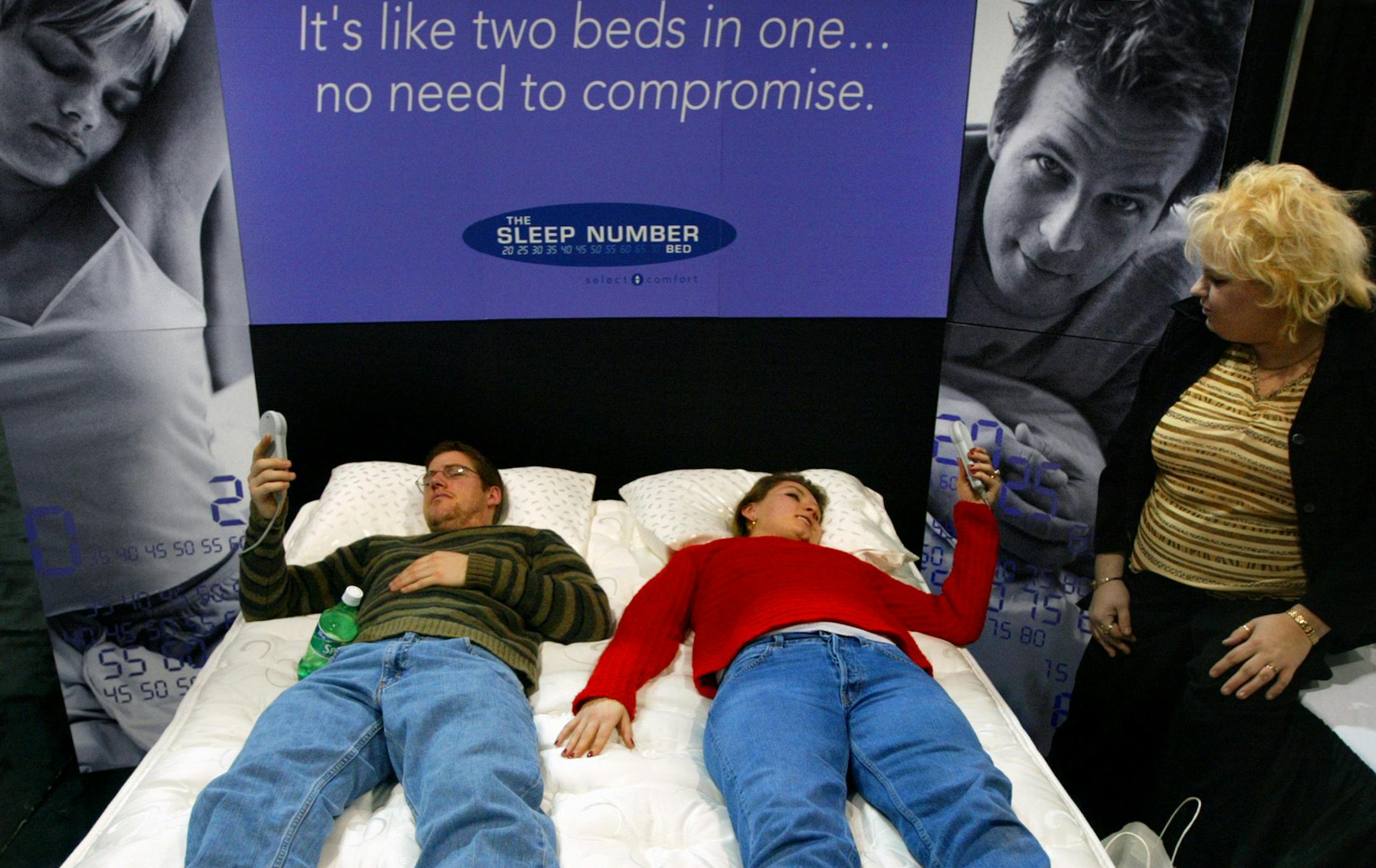 Bob Berg and Liz Thompsen, both of St. Paul, check out a Sleep Number bed at the Twin Cities Bridal Association Wedding Fair at the Minneapolis Convention Center Sunday afternoon.