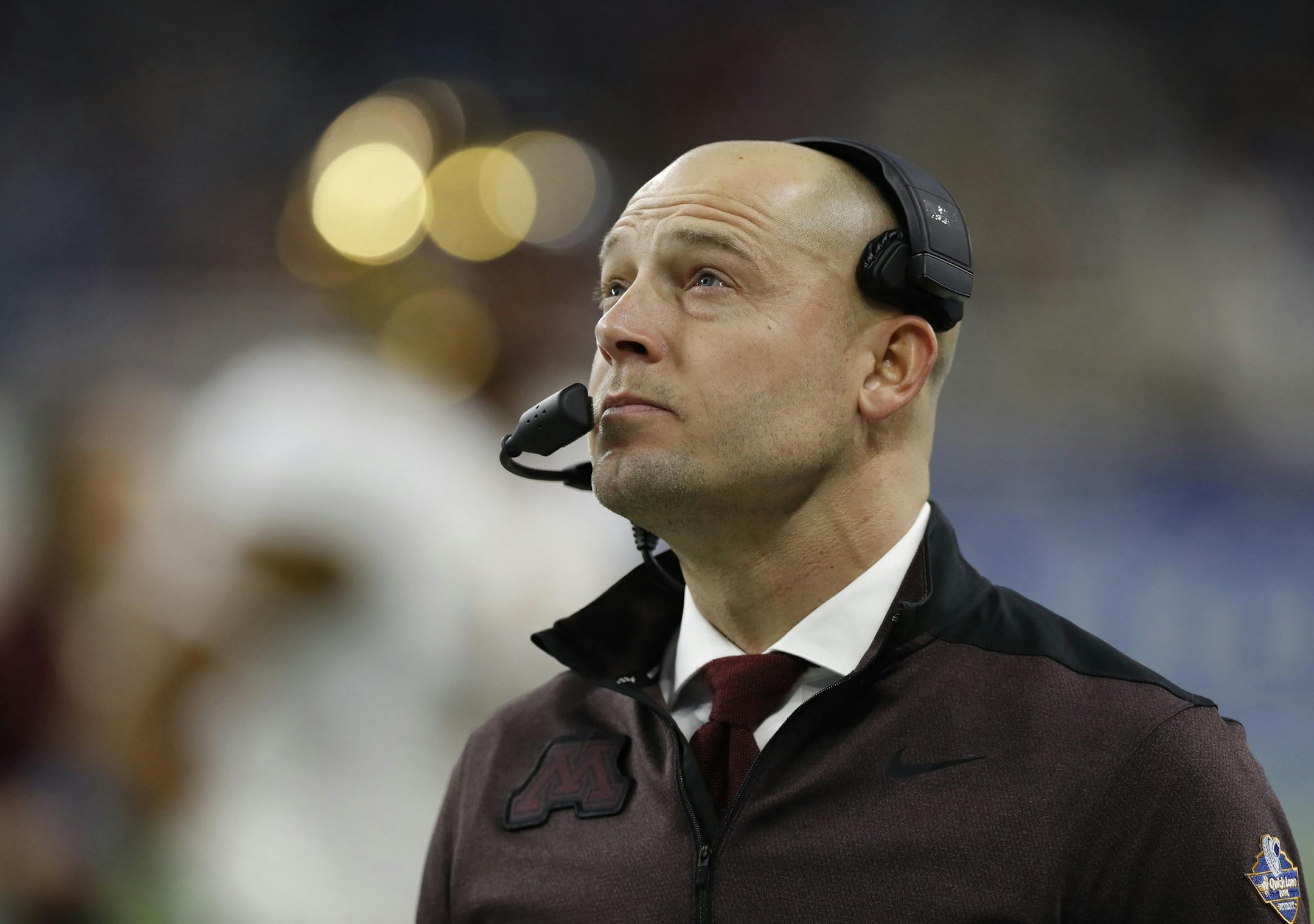 Minnesota head coach P.J. Fleck walks on the sidelines during the Quick Lane Bowl NCAA college football game against Georgia Tech, Wednesday, Dec. 26, 2018, in Detroit. Minnesota won 34-10. (AP Photo/Carlos Osorio) ORG XMIT: MERff1490fe748e99101bd743033cf8e