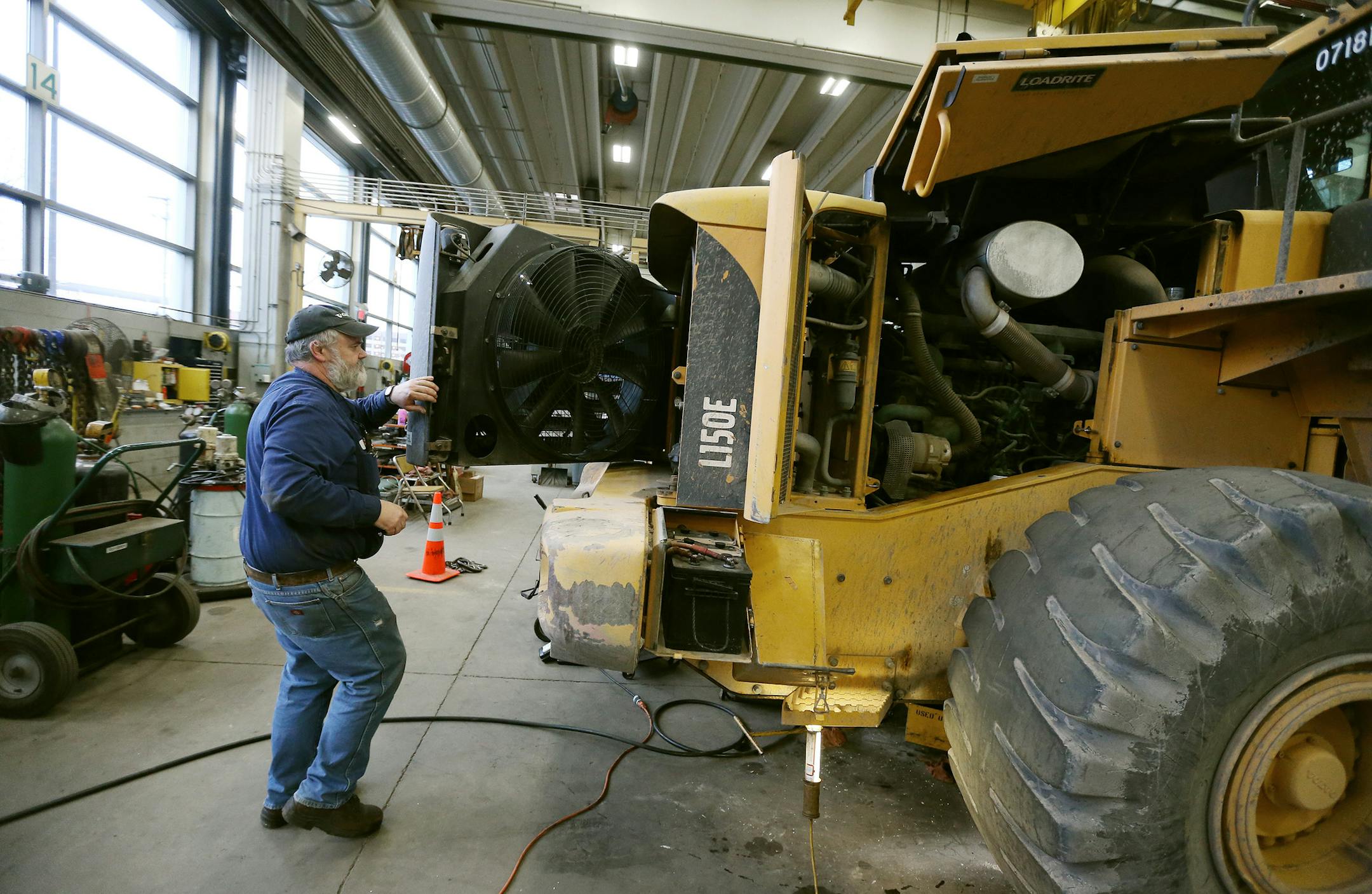 Dale Cannon inspected the radiator of pieces of heavy equipment at the City of Minneapolis fleet services Thursday December 24, 2015 in Minneapolis, MN. ] Jerry Holt/ Jerry.Holt@Startribune.com