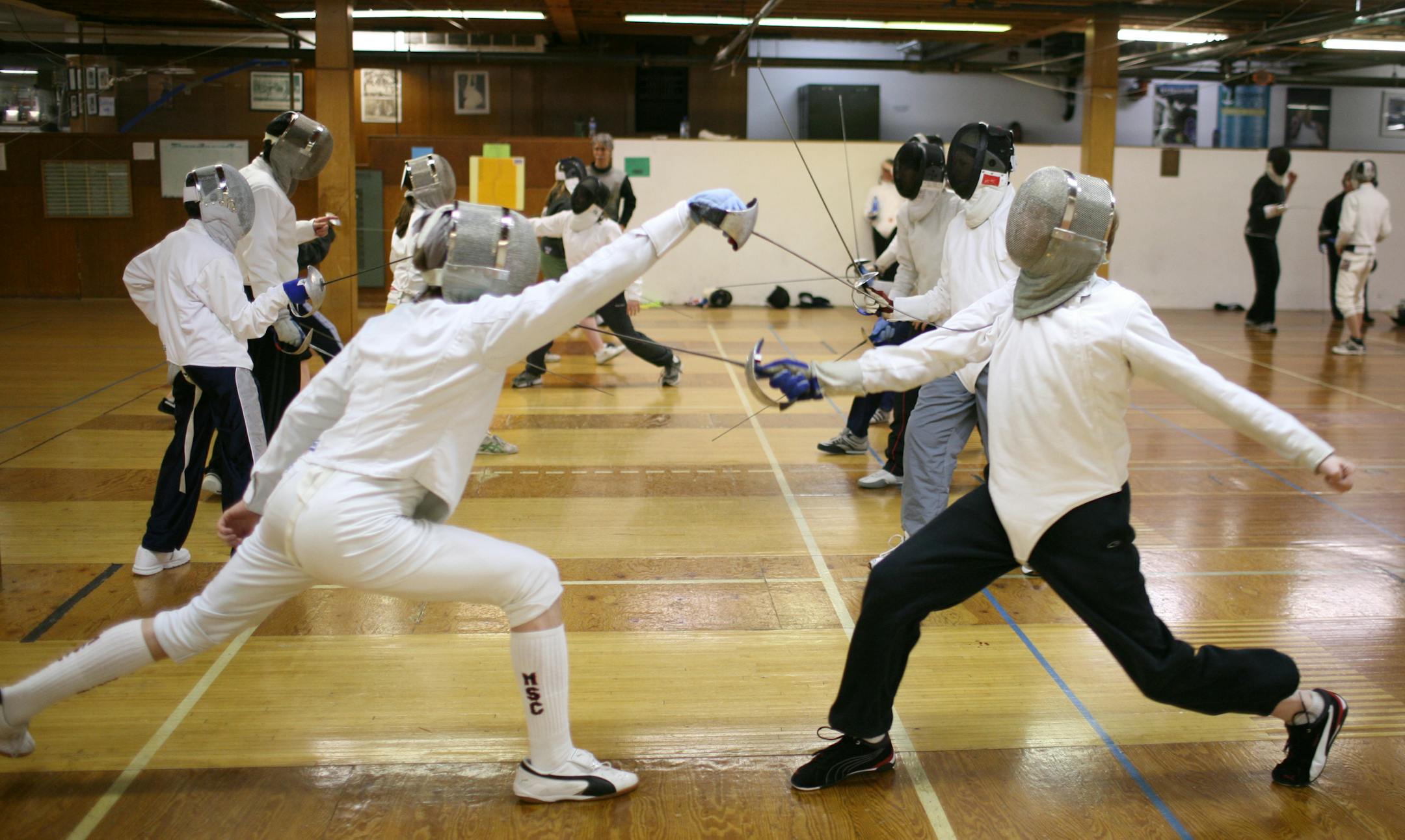 Matt Thompson, left, and Karl Beck during a sabre exercise at Thursday evening's class at the Minnesota Sword Club in Minneapolis.