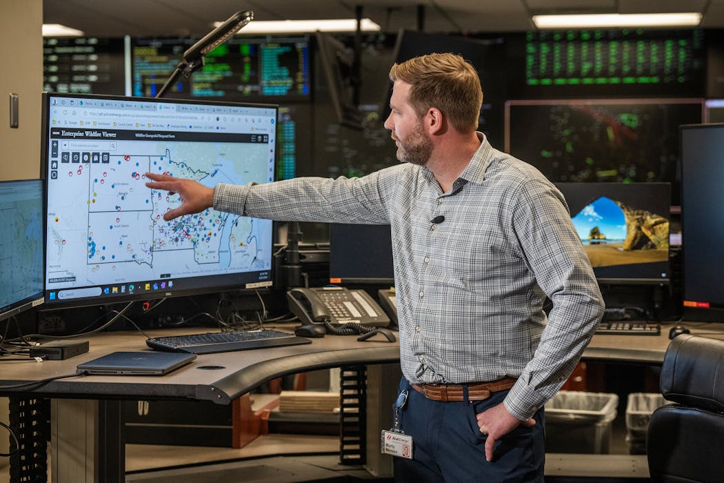 Xcel Energy Regional Vice President of Distribution and Operations Marty Mensen explains how he can track weather and other risks to Xcel Energy in the region at the control center in Minneapolis on April 24.