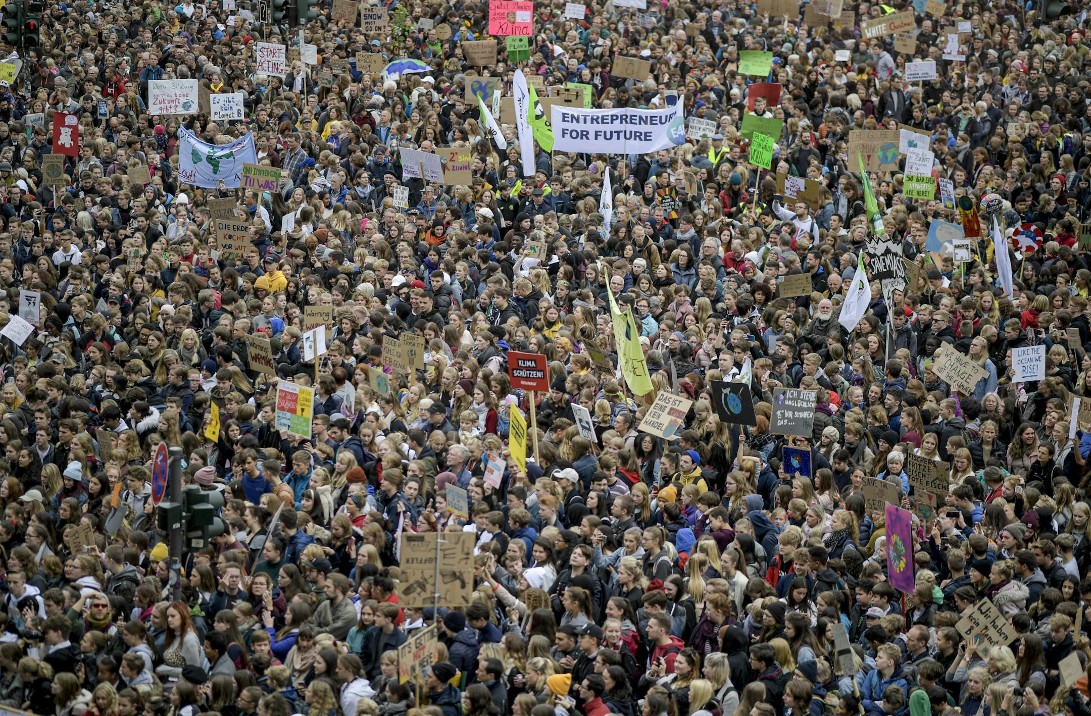 People attend a 'Fridays For Future' rally in Hamburg, Germany, Friday, Sept. 20, 2019. Protests of the 'Fridays For Futurte' movement against the increase of carbon dioxide emissions are planned Friday in cities around the globe. In the United States more than 800 events were planned Friday, while in Germany more than 400 rallies are expected.