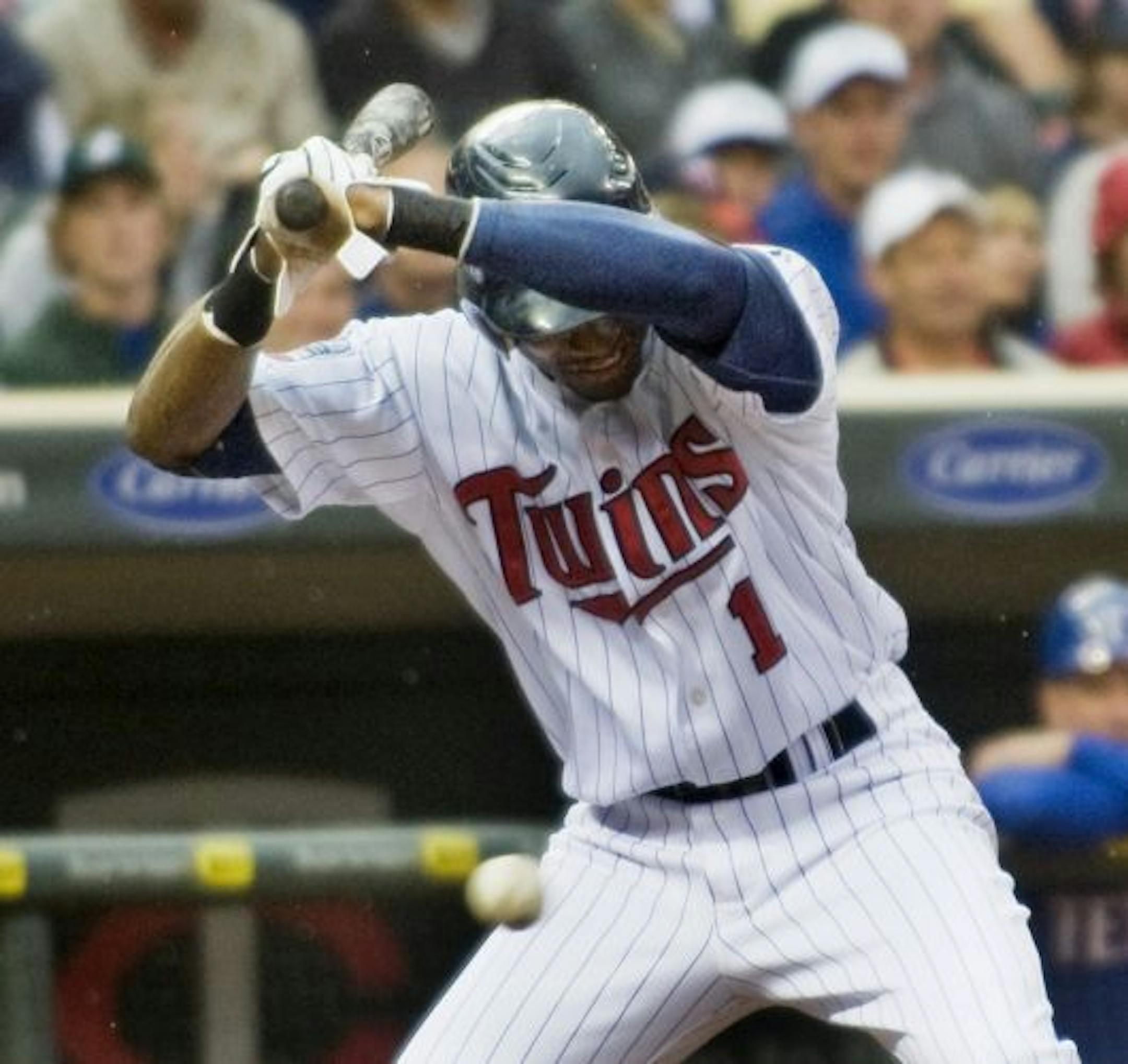 Orlando Hudson dodged an inside pitch by Texas starter Derek Holland on Sunday. Acquiring second baseman Hudson and shortstop J.J. Hardy in the offseason has given the Twins a reliable middle infield for the first time in several seasons.