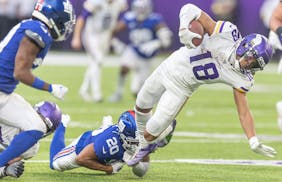 Vikings wide receiver Justin Jefferson (18) runs past New York Giants safety Julian Love (20) during their Dec. 24 game. They will play each other Sun