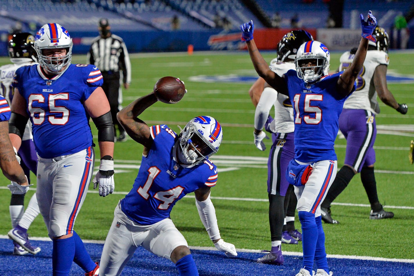 Buffalo Bills wide receiver Stefon Diggs (14) celebrates after scoring a touchdown during the second half of an NFL divisional round football game against the Baltimore Ravens Saturday, Jan. 16, 2021, in Orchard Park, N.Y. (AP Photo/Adrian Kraus)