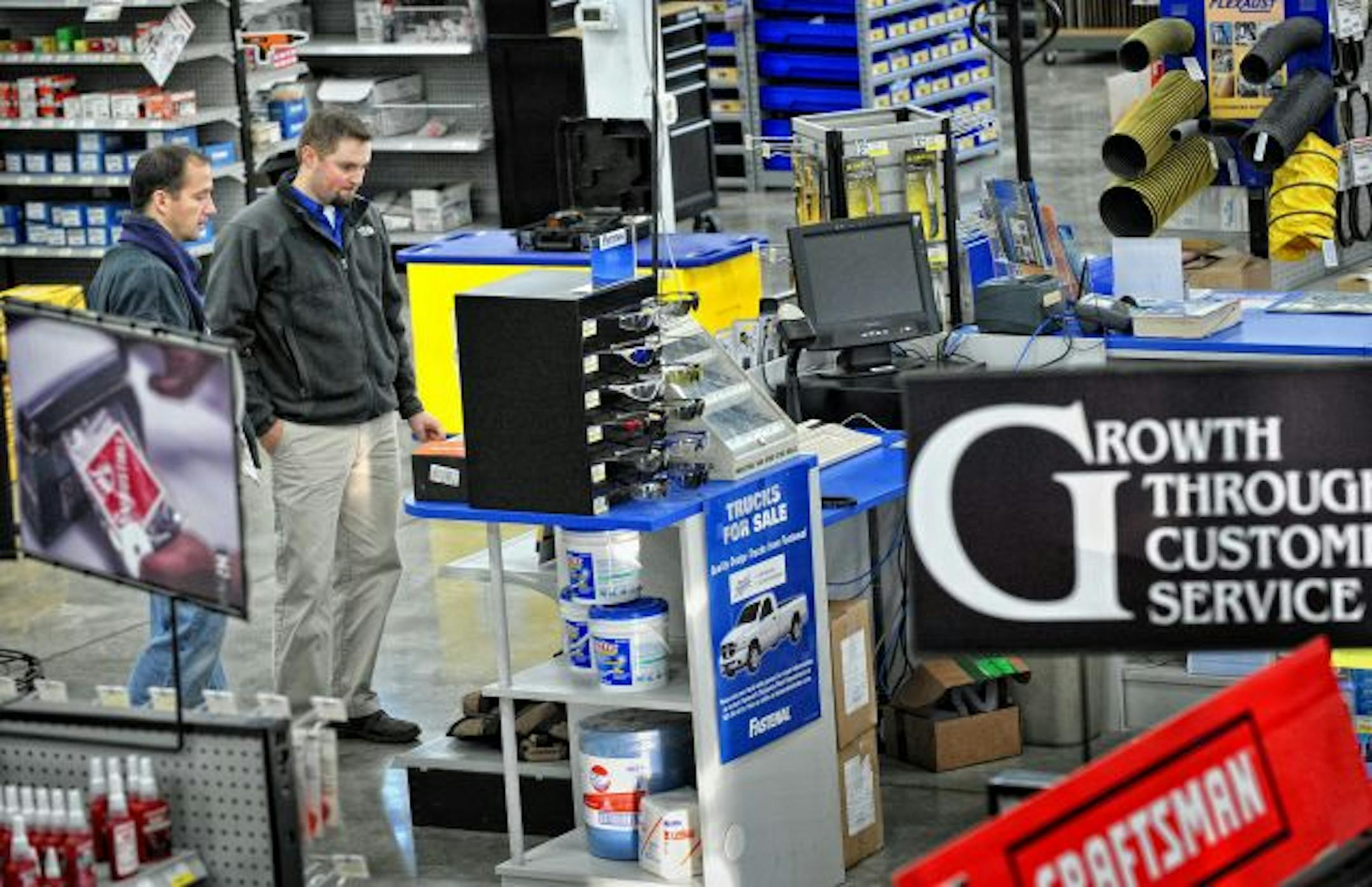 Burnsville Fastenal general manager Graham Sievers, right helped customer Joel Posner with a hardware selection.