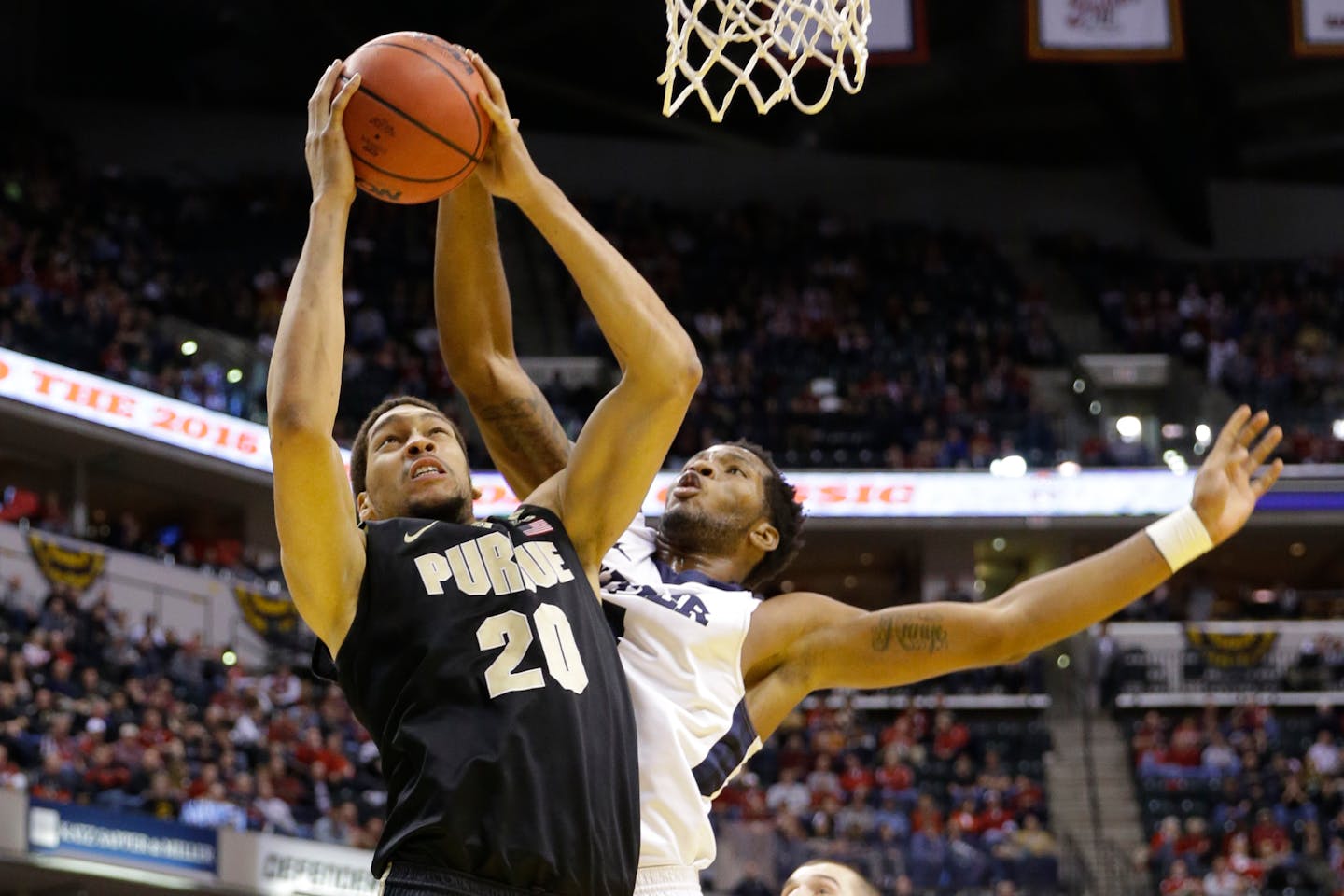 Purdue center A.J. Hammons (20) shoots in front of Butler forward Tyler Wideman (4) in the second half of an NCAA college basketball game in Indianapolis, Saturday, Dec. 19, 2015. Butler defeated Purdue 74-68. (AP Photo/Michael Conroy)