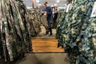 Alex Kilpatrick shopped for new camouflage pants and a hat at Gander Mountain in Blaine Friday. He is going hunting up near Cambridge with his son thi