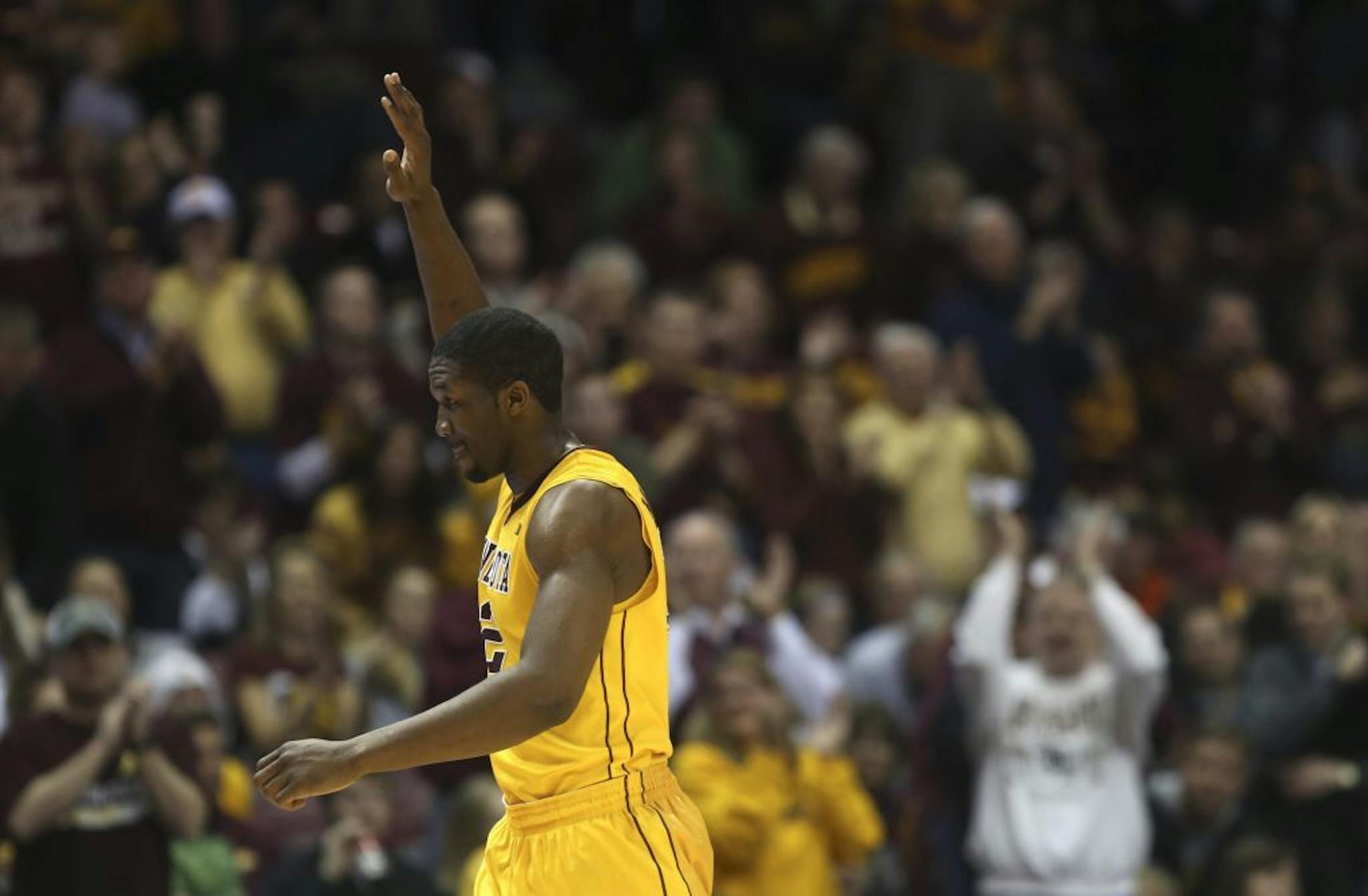 Trevor Mbakwe waved to the crowd after receiving a standing ovation after being taken out near the end of the second half at Williams Arena in Minneapolis on Saturday, March 2, 2013. Gophers won 73-44.