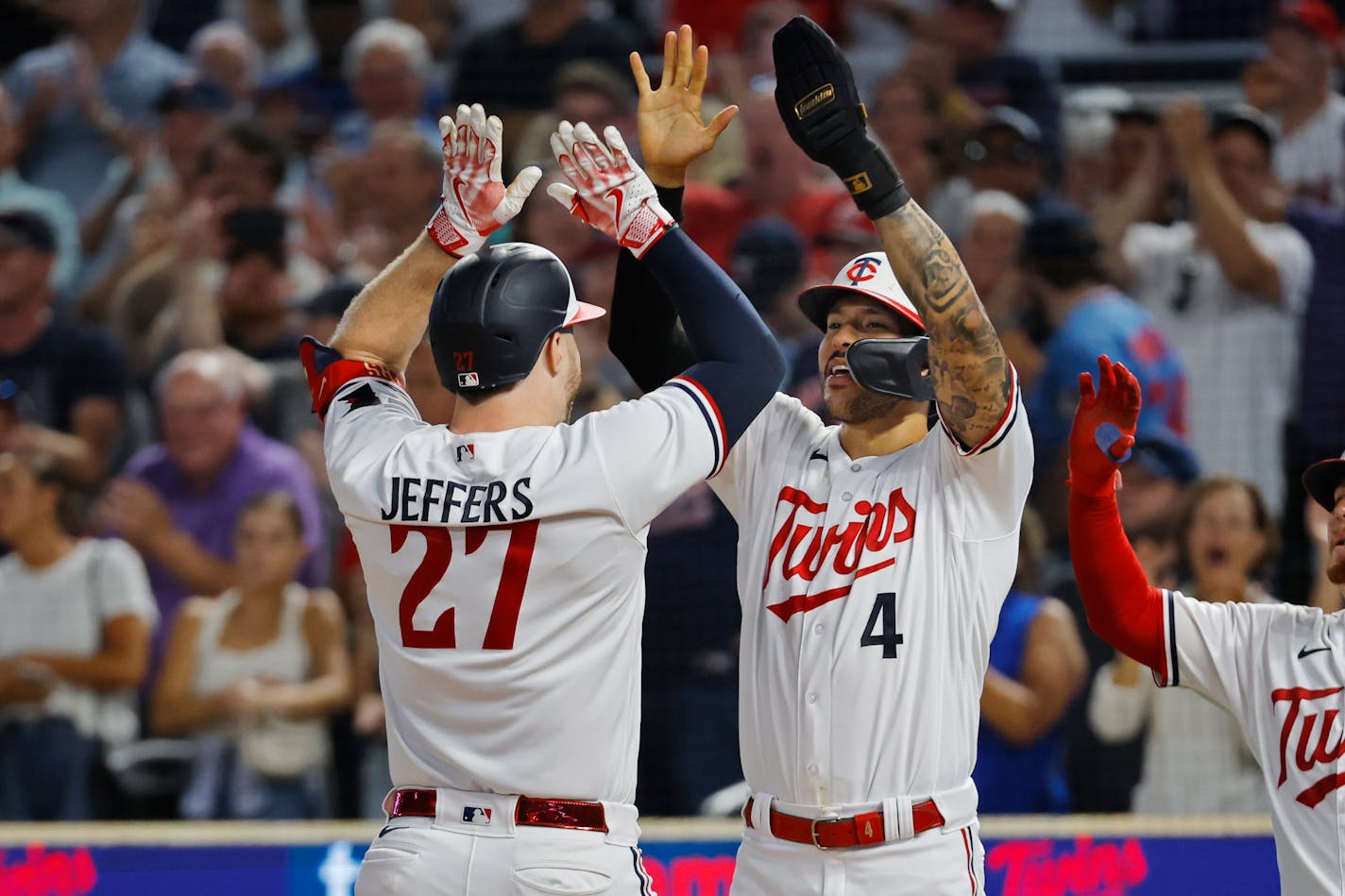 Ryan Jeffers celebrated with Carlos Correa after hitting a two-run home run against the Rangers Thursday