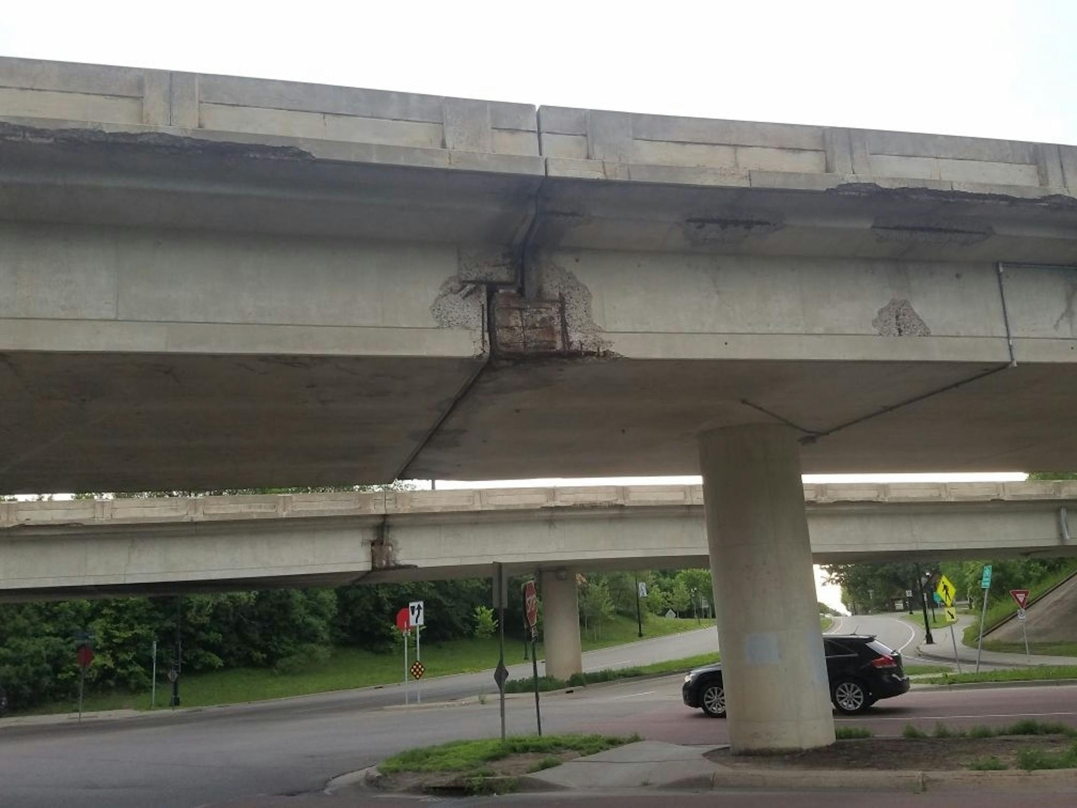 Three bridges on W. Broadway Avenue that carry passengers between Minneapolis and Robbinsdale will be replaced in 2020. The bridges are discolored and cracked, and corroded steel bars show through on the underside where concrete has fallen away.