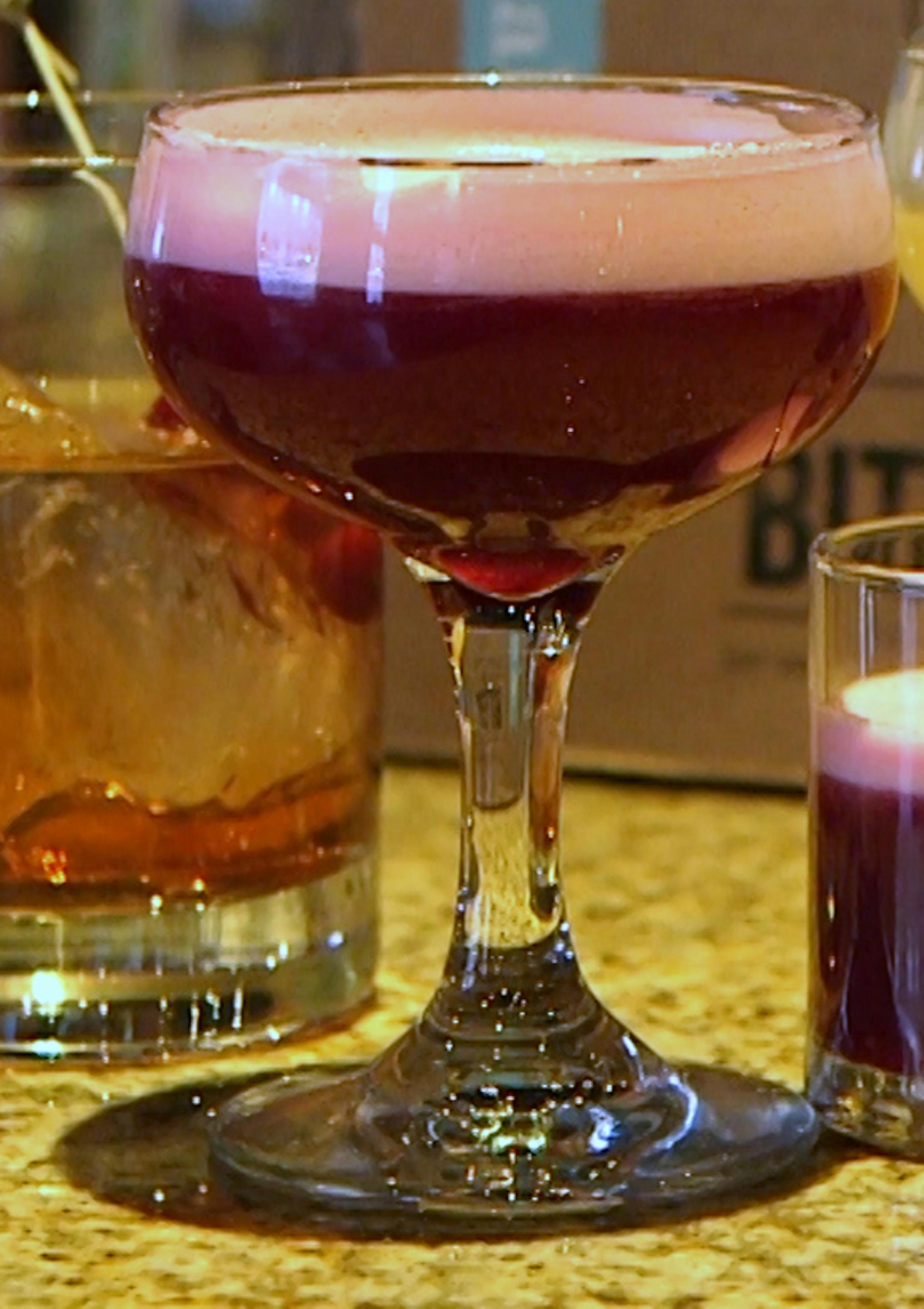 Bartender Robert Jones at Saffron demonstrates drinks made with bitters. ] still frame from video