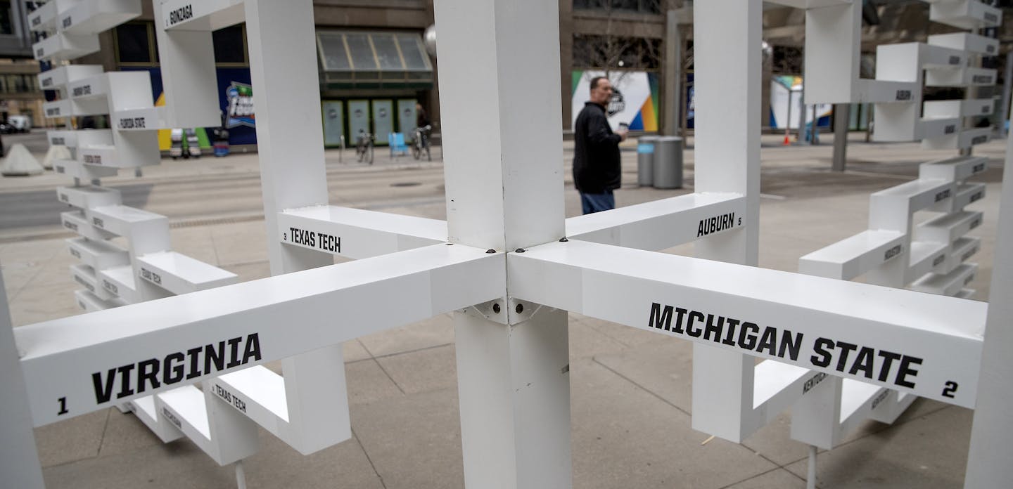 The Final Four teams were finally placed on the giant bracket sculpture near the IDS Center, Monday, April 1, 2019 in Minneapolis, Minn. (Elizabeth Flores/Minneapolis Star Tribune/TNS)