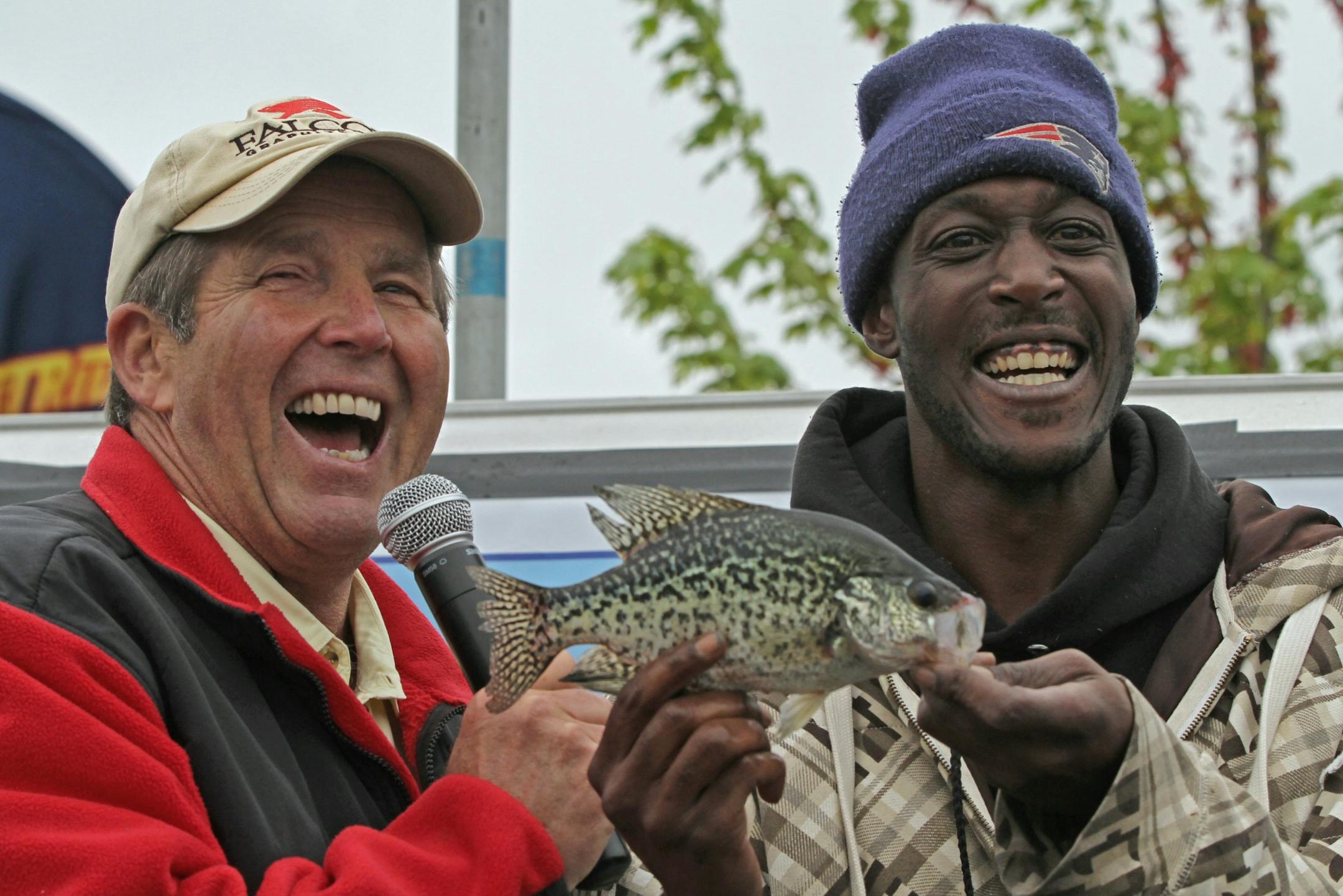 (left to right) Ron Schara joked with Shawn Walton of Columbia Heights as he weighed in his fish in the Minnesota Bound's Crappie Contest on Lake Minnetonka. Under sponsorship by Ron Schara's Minnesota Bound television show, the contest pre-registered over 1000 anglers for the event based out of Lord Fletcher's on Lake Minnetonka, 5/5/12.