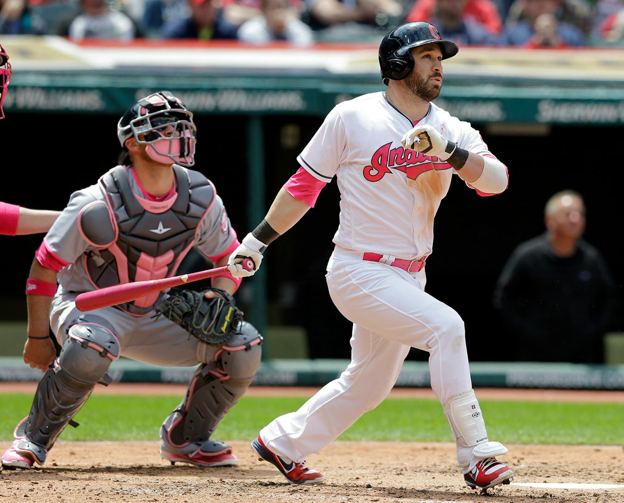 Cleveland Indians' Jason Kipnis watches his ball after hitting a three-run home run off Minnesota Twins' Adam Wilk in the third inning of a baseball game, Sunday, May 14, 2017, in Cleveland. Lonnie Chisenhall and Roberto Perez scored on the play. Minnesota Twins catcher Chris Gimenez watches.