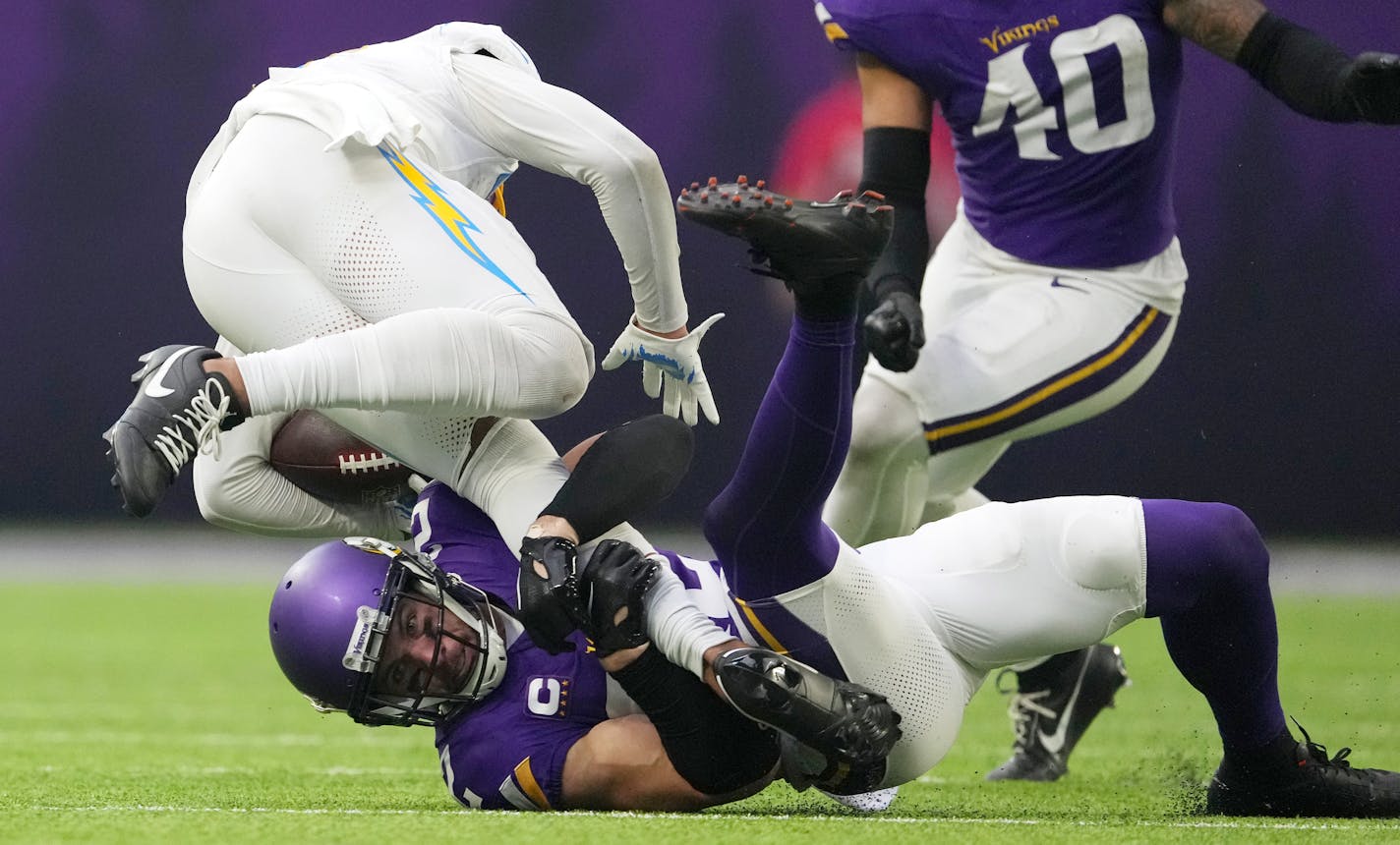 Los Angeles Chargers wide receiver Keenan Allen (13) is brought down by Minnesota Vikings safety Harrison Smith (22) in the third quarter of an NFL game between the Minnesota Vikings and the Los Angeles Chargers Sunday, Sept. 24, 2023 at U.S. Bank Stadium in Minneapolis. ] ANTHONY SOUFFLE • anthony.souffle@startribune.com