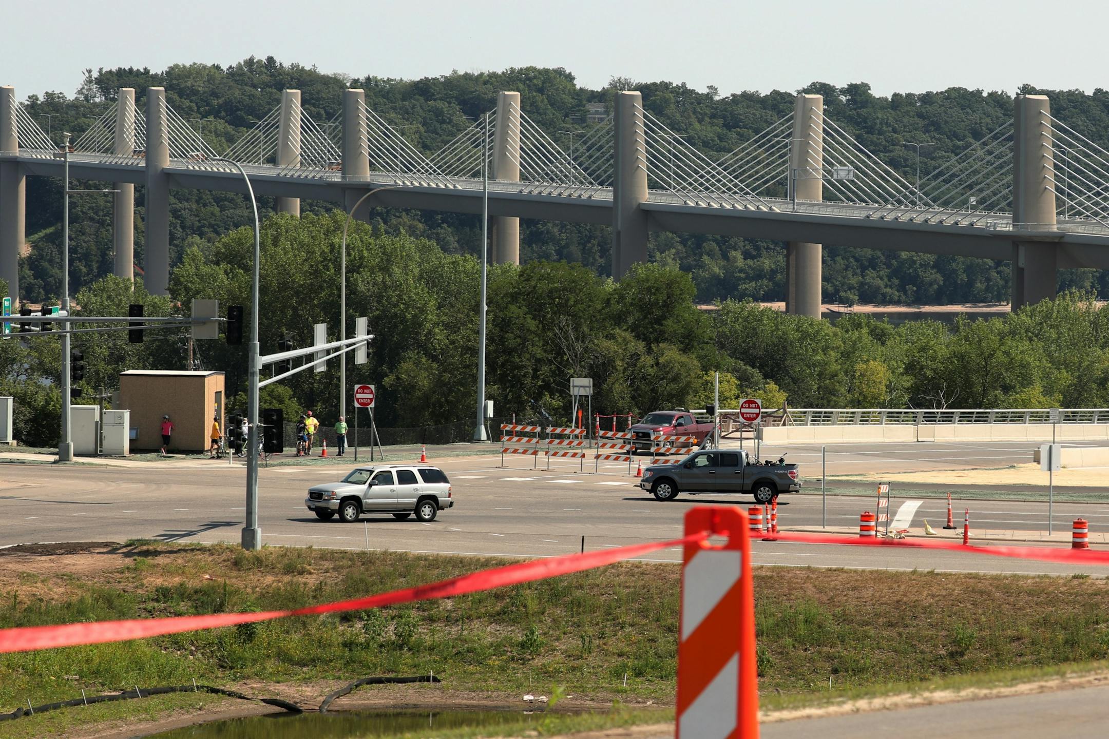 The new St. Croix River bridge could be seen in the distance from the ribbon-cutting ceremony on Wednesday afternoon. Hours later, the bridge opened to drivers.