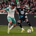 Austin FC midfielder Ethan Finlay and Loons midfielder Joseph Rosales fought for control of the ball during Saturday's match at Q2 stadium in Austin, 
