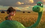 Spot, voiced by Jack Bright, left, and Arlo, voiced by Raymond Ochoa, in a scene from "The Good Dinosaur."