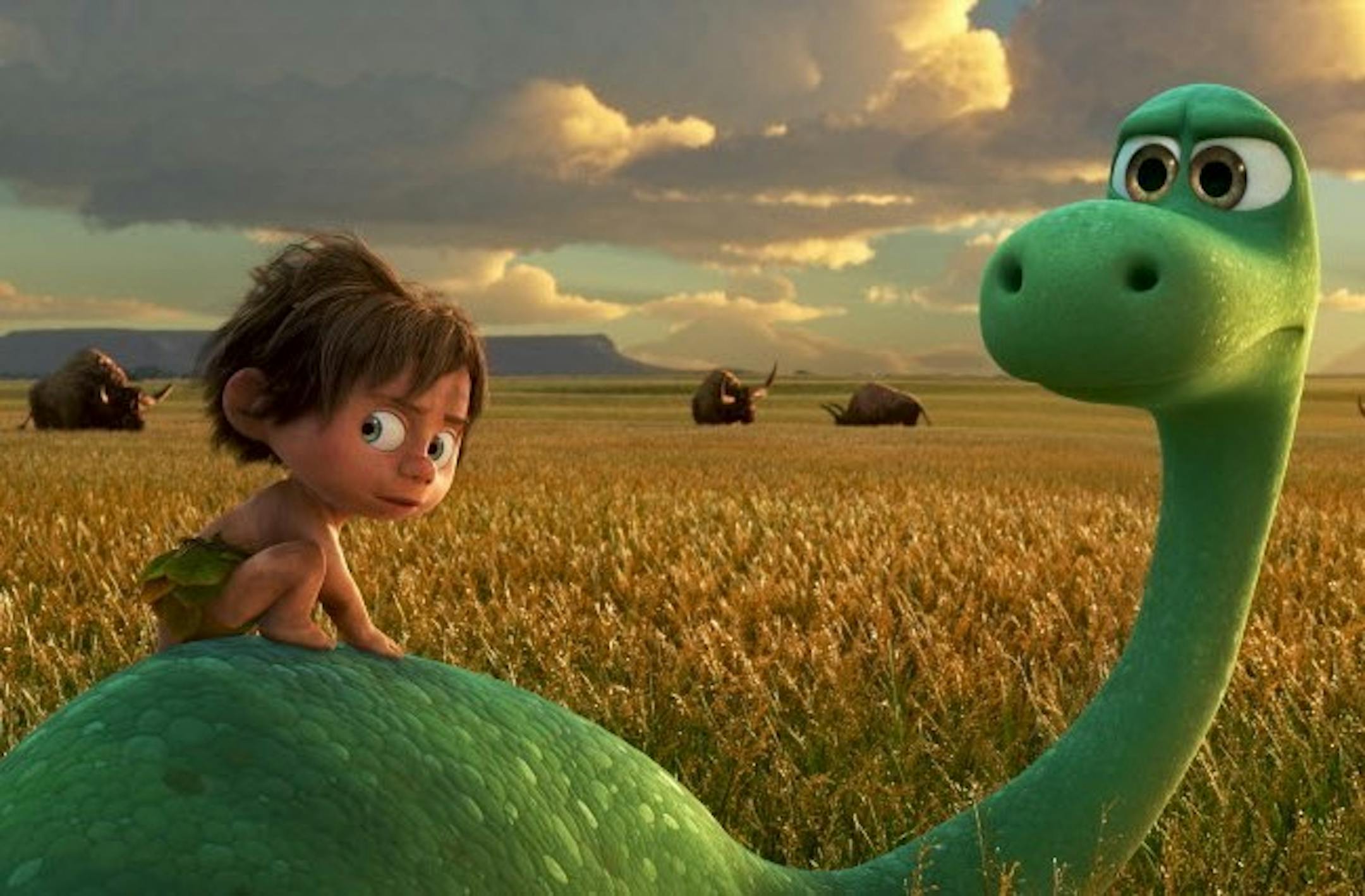 Spot, voiced by Jack Bright, left, and Arlo, voiced by Raymond Ochoa, in a scene from "The Good Dinosaur."
