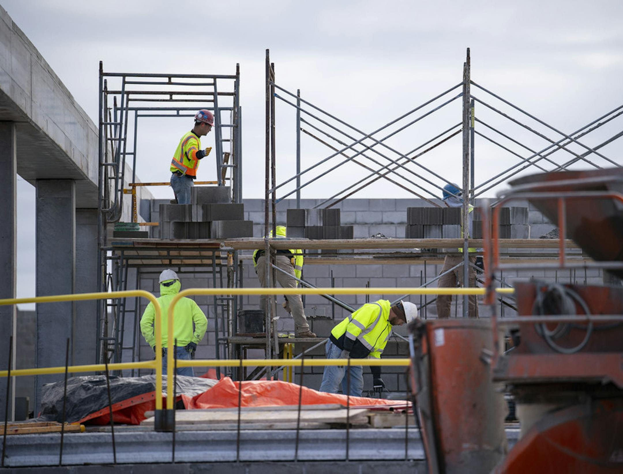 Construction workers stood on scaffolding as they worked on building the Vue at BlueStone apartments April 1.
ALEX KORMANN &#x2022; alex.kormann@startribune.com