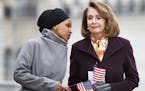 Rep. Ilhan Omar (D-Minn.), left, talks with House Speaker Nancy Pelosi (D-Calif.) during a news conference outside the U.S. Capitol in Washington, Mar